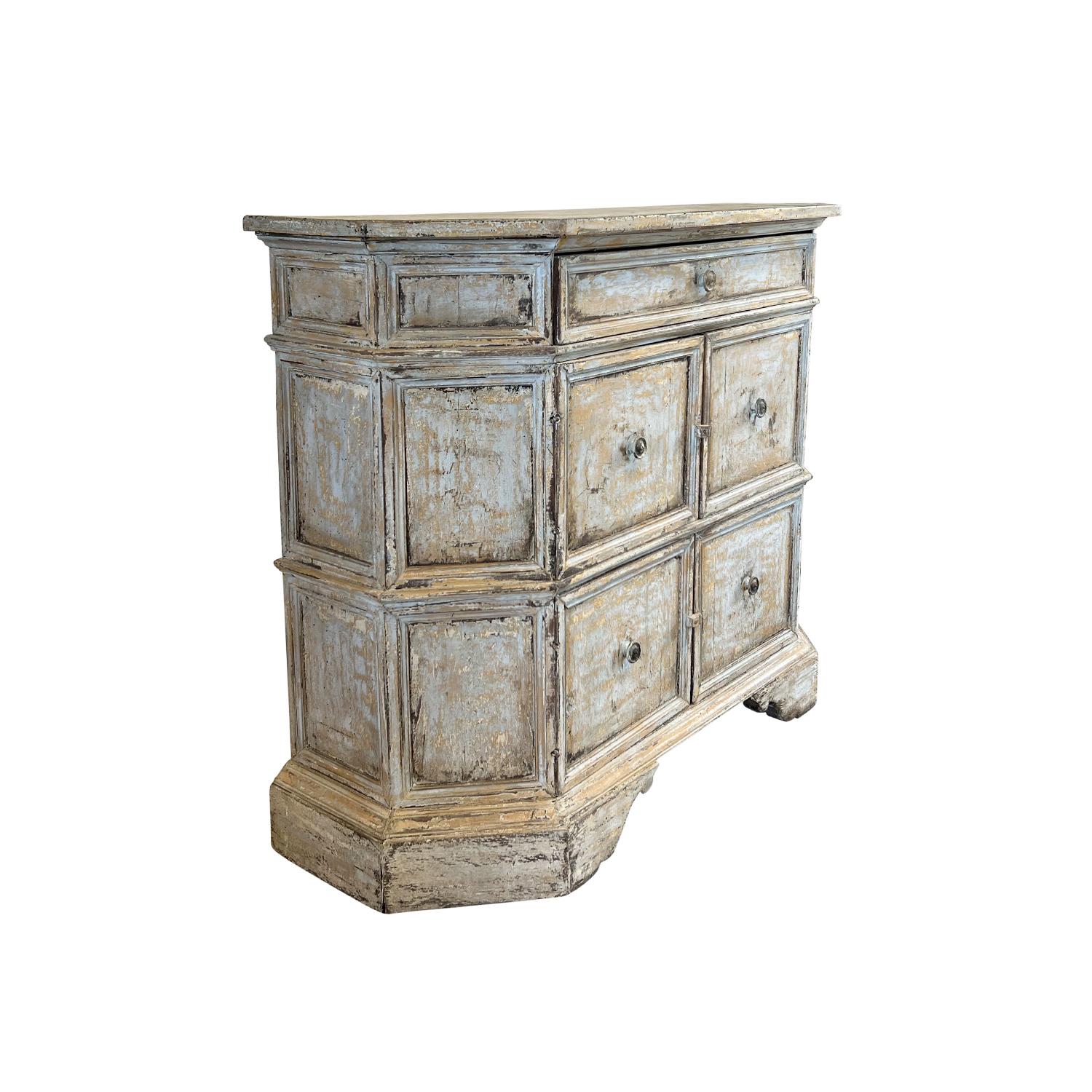 An early 19th Century Italian commode made of hand crafted painted Pinewood, in good condition. The single Arte Povera raised cabinet, credenza is composed with four door panels and one large drawer on the top, supported by an arched wooden frame,