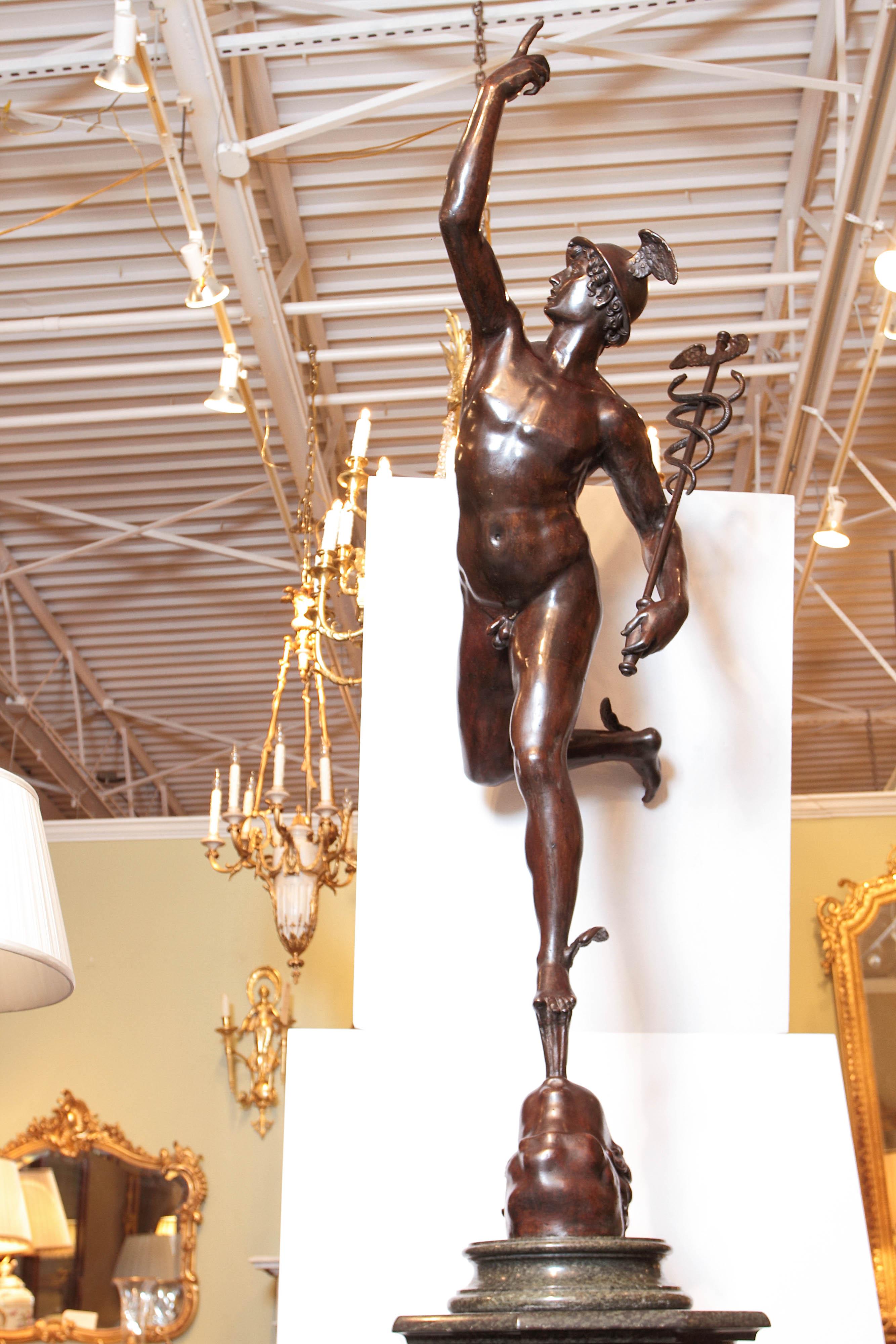 A beautiful 19th century Italian patinated bronze figure of Mercury after the model by Giambologna. Resting on a marble pedestal