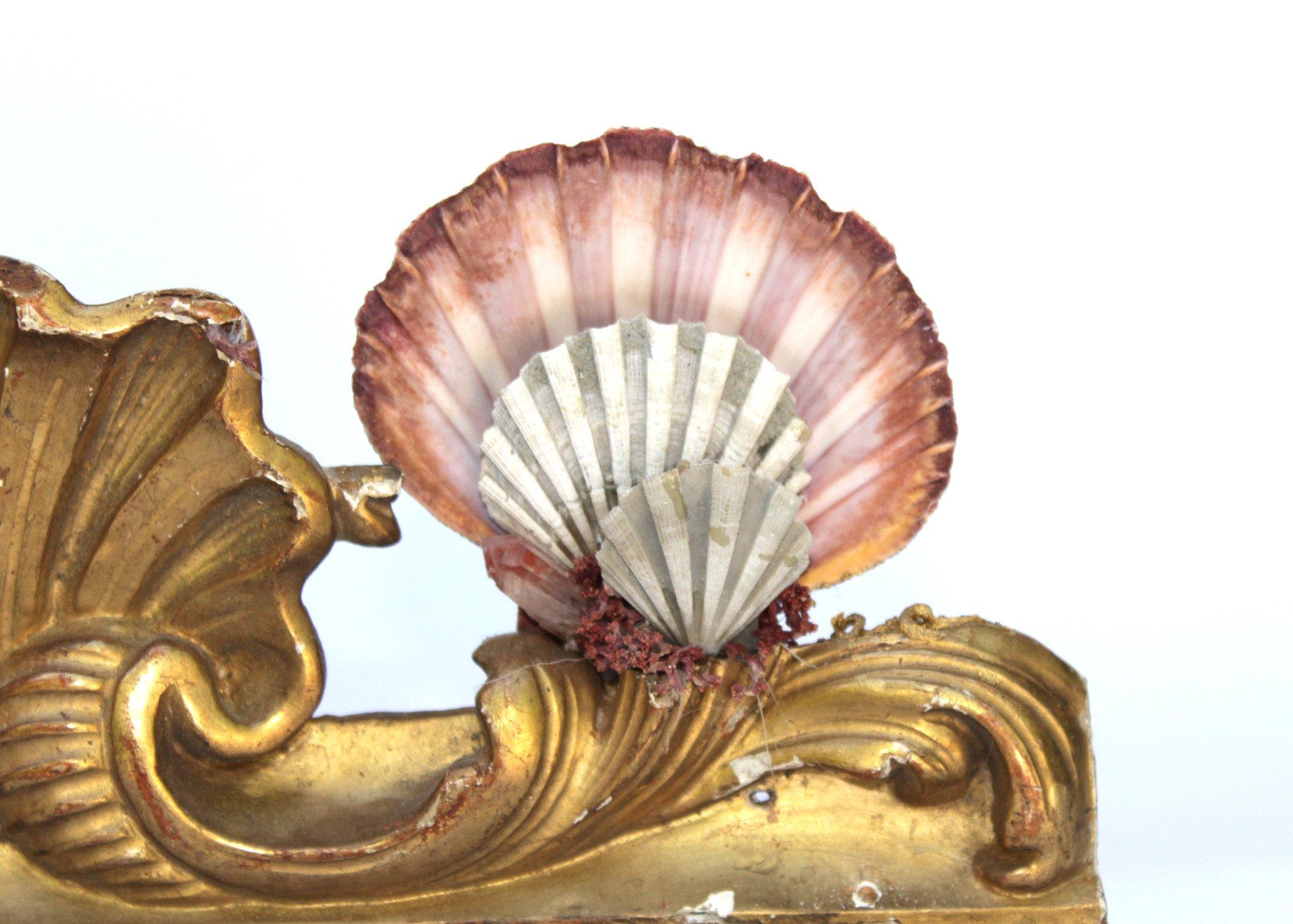 19th century Italian pediment fragment decorated with pectin shells and red phantom crystal points on a lucite base.

The piece is put together by Jean O'Reilly Barlow, the artist and creative director of Interi. The date of manufacture reflects