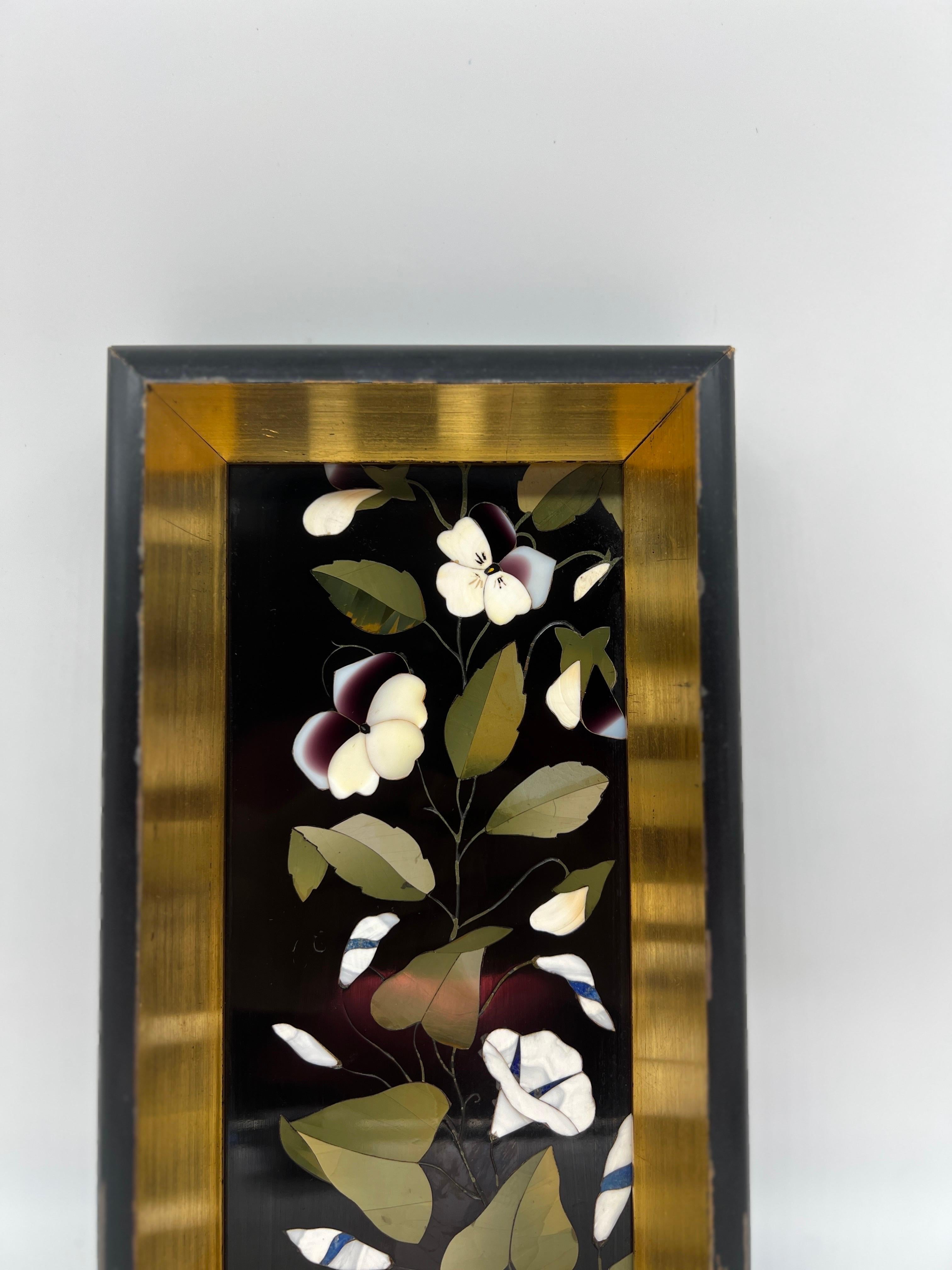 Italian, 19th century.

A fine quality Italian marble Pietra Dura plaque showcasing beautiful white calla lily flowers and vines. The piece is likely a fragment taken from a much larger piece. Set inside a quality giltwood frame. 