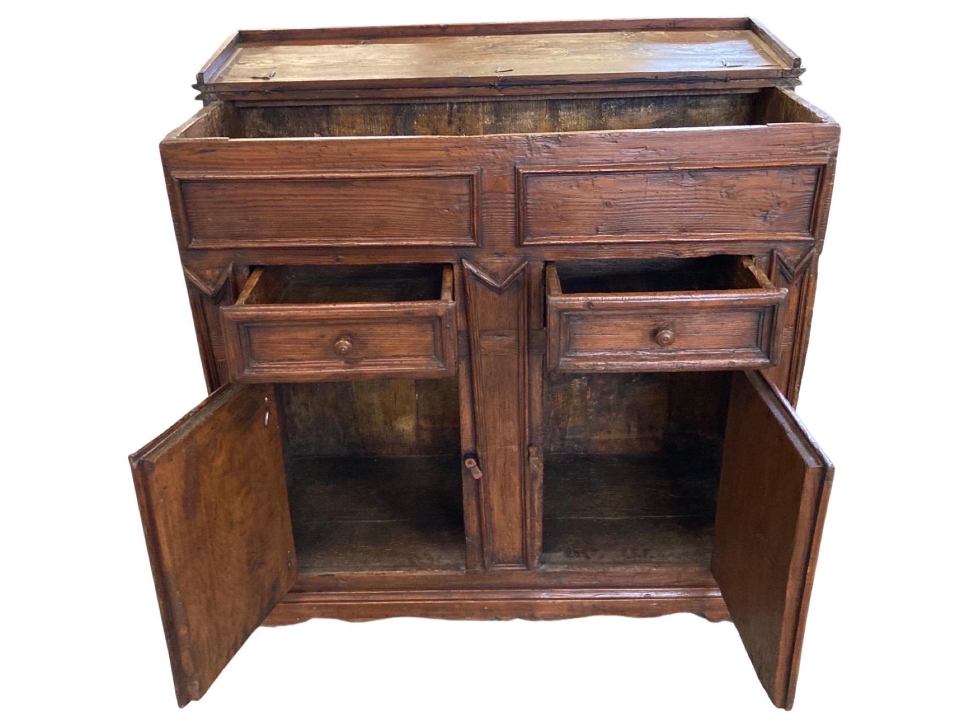 Buffet, or madia, hand-made in Italy in the early 1800s using pine. The wood has been stained a walnut color, which gives this buffet a very warm and elegant look. In fact, this is a piece that although was originally made for a country home, it
