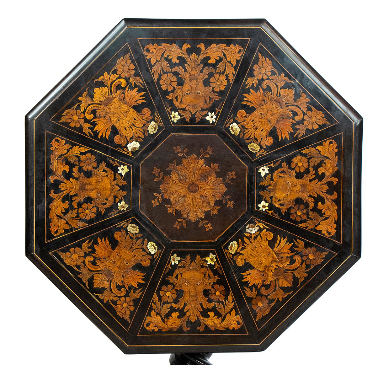 Fantastic marquetry inlaid octagonal folding table - Tuscany, 19th century, FALCINI ambit.
 Inlaid in mother-of-pearl and fruit woods in the manner of Giuseppe Arcimboldo, supported by a twisting leg resting on an octagonal base raised on four feet;
