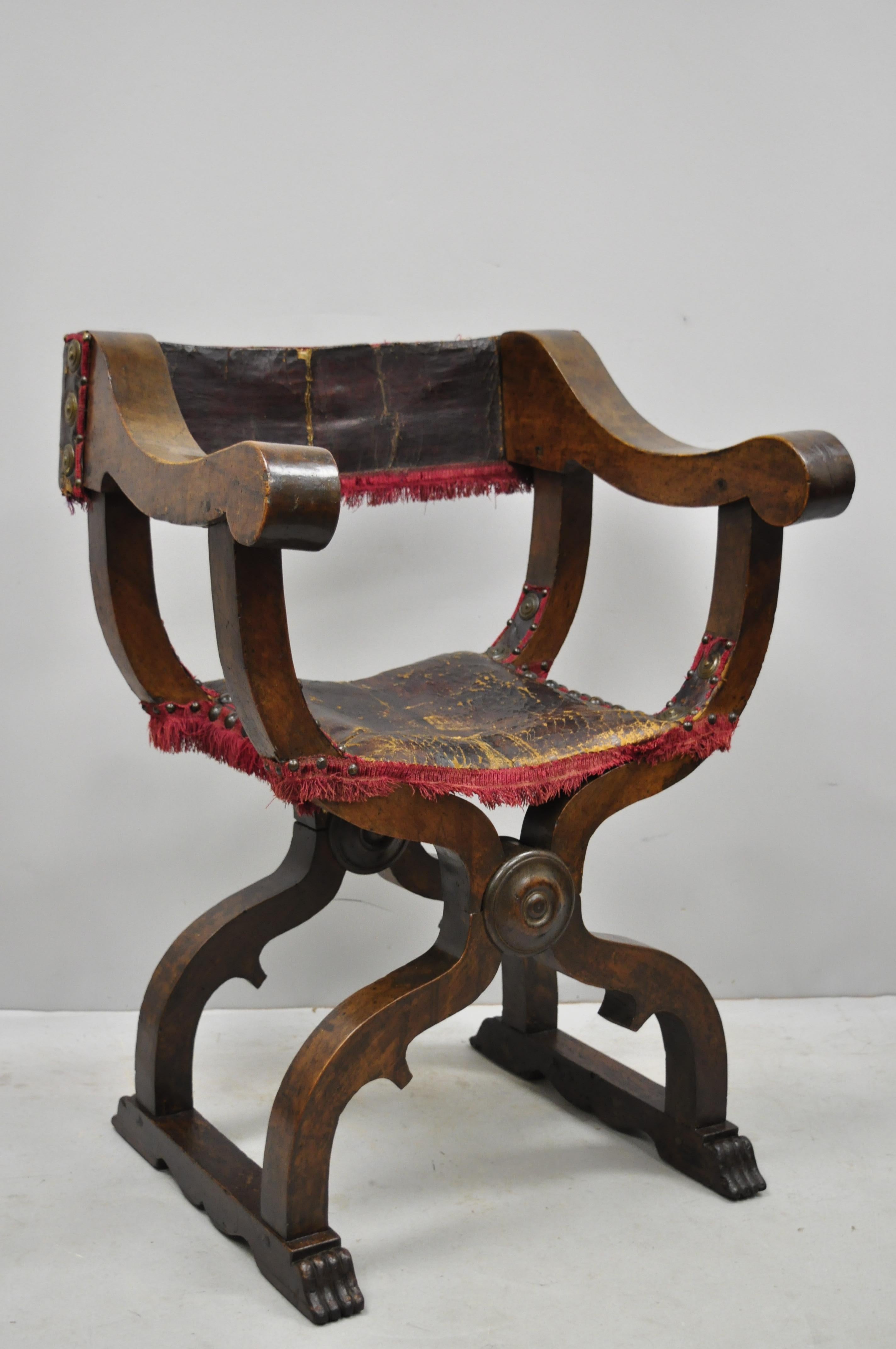 19th century Italian Renaissance Savonarola walnut and leather armchair. Item features remarkable aged patina, solid wood construction, original Sotheby's label, circa mid-19th century. Measurements: 36.5