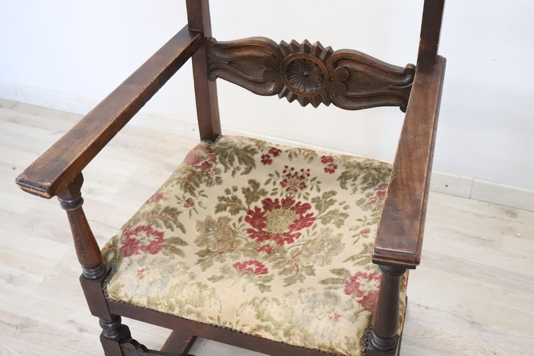 Beautiful antique rare Renaissance style armchair in carved oakwood. The armchair presents a work of wood carving of high artistic quality. The back is decorated the little feet are in the shape of lion's feet the legs are turned. Two comfortable