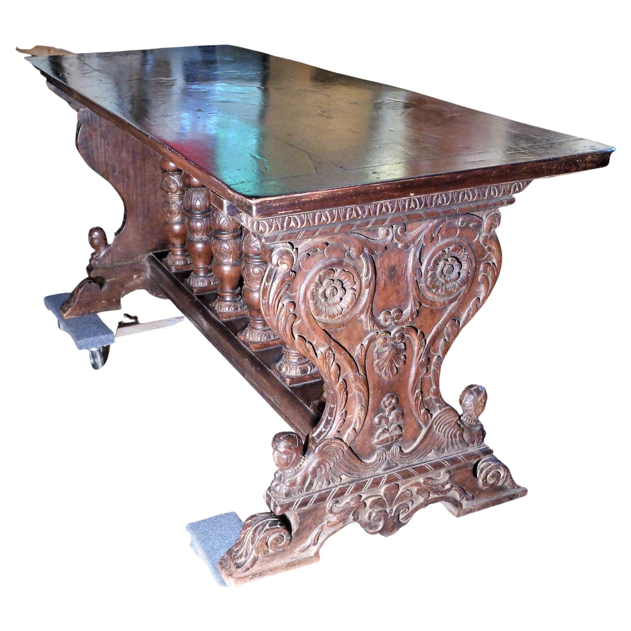 Italian Renaissance style carved walnut library table ( hall table, console table, refectory type table ) w/ thick wide two board top in beautifully aged original rich surface color. Measures 78
