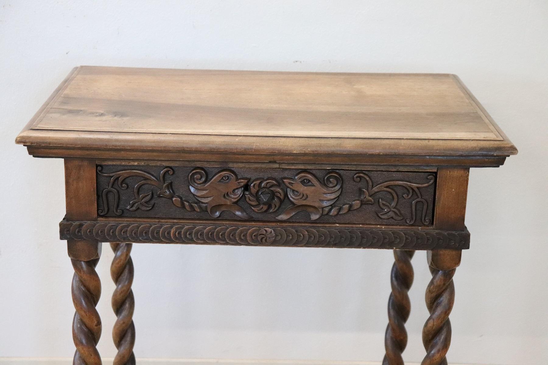 Beautiful small table in solid walnut wood. Special turned legs made of solid wood. The band has a carved wooden decoration. The decoration is present on each side of the table so it is also nice positioned in the center of the room. On the front a