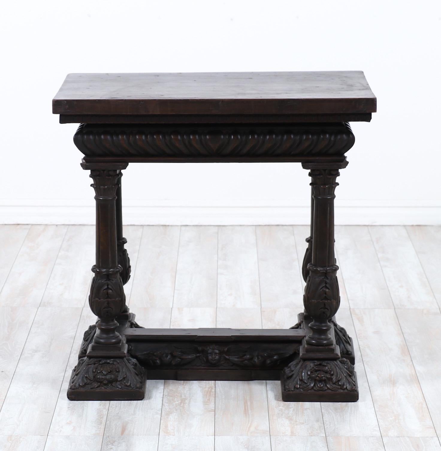 Glorious, 19th century Italian carved walnut center table in the Renaissance style 

This rare table consists of a solid rectangular top with a a heavily carved base including detailed columns, depictions of cherubs, animals and floral