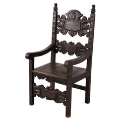 19th-century Italian Renaissance-style throne armchair with carvings.
