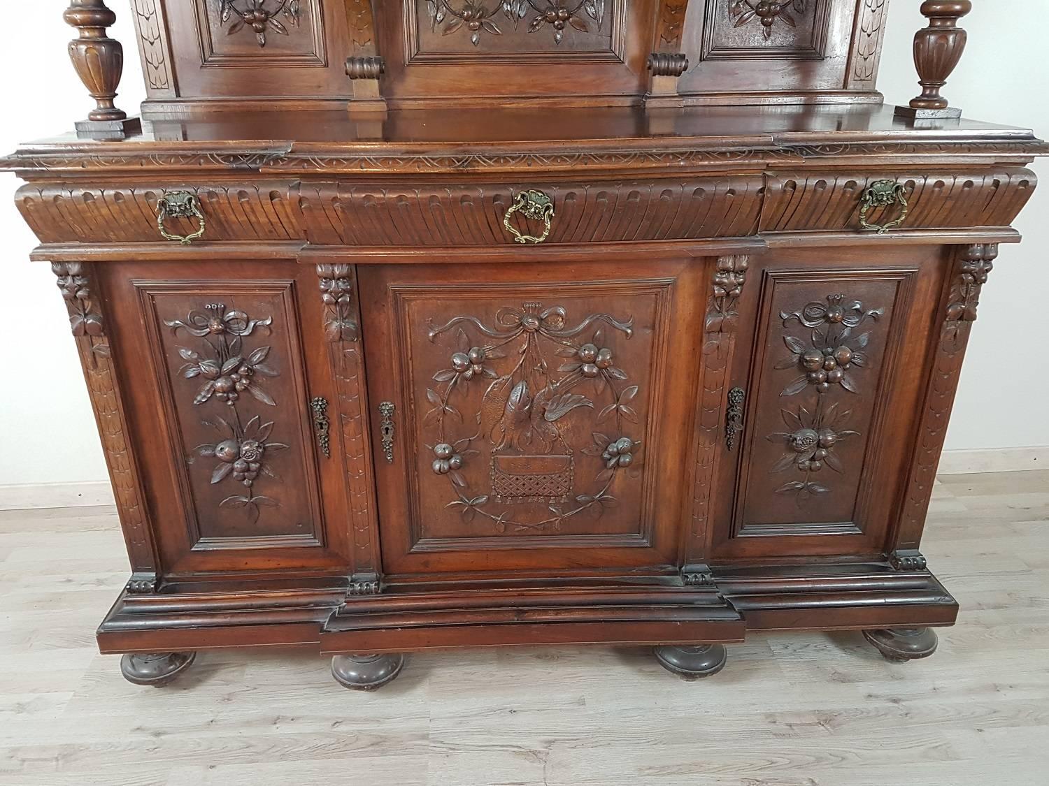 Beautiful monumental sideboard carved cabinet buffet historical period late 19th century, 1880-1890 fine walnut worked in perfect neo-Renaissance style with typical mythological representations of the Renaissance period. The buffet is richly carved