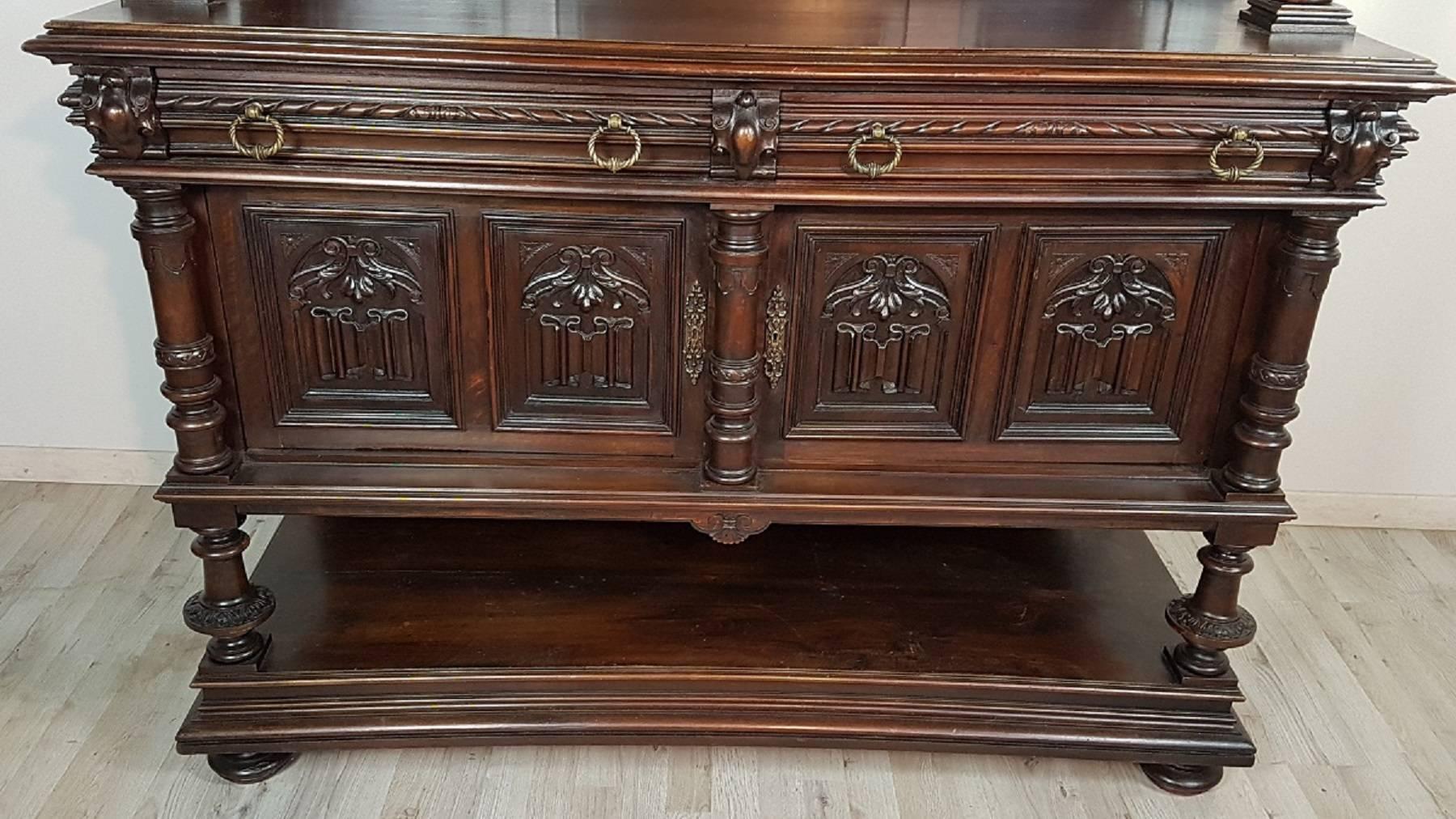 Beautiful monumental sideboard carved cabinet buffet historical period late 19th century, 1880-1890 fine walnut worked in perfect neo-Renaissance style with typical mythological representations of the Renaissance period. The sideboard in question is