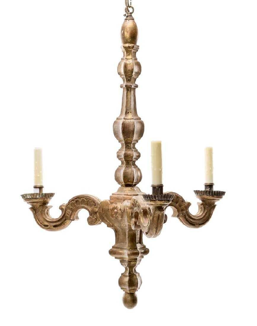 Charming 19th century 3-arm chandelier made from gilded wood with intricate carvings. Available as a singular piece.