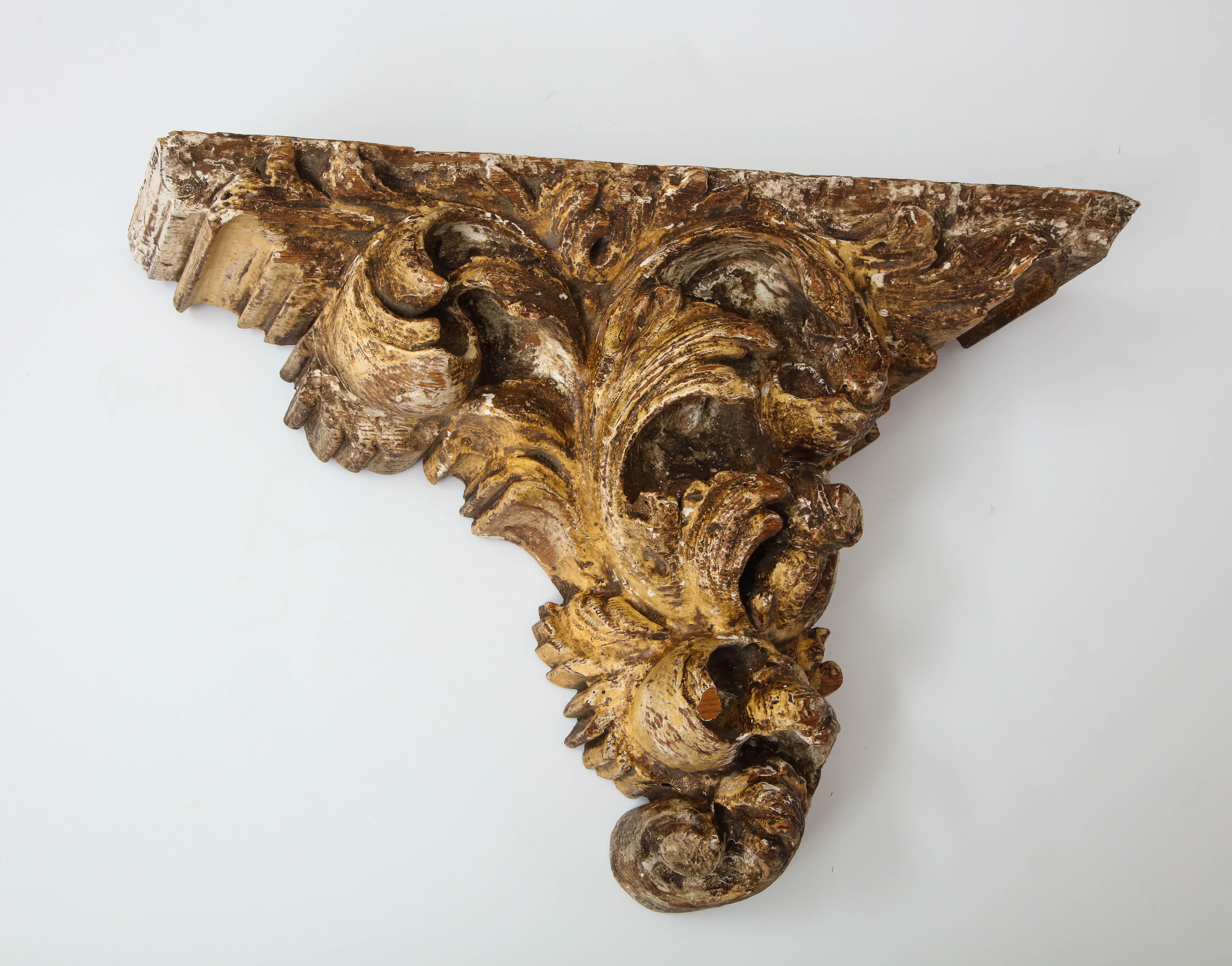 Italian Rococo style hand carved giltwood wall bracket, 19th century. Has metal cleat on back for secure mounting. Substantial. Shows some wear and one small piece has broken off.