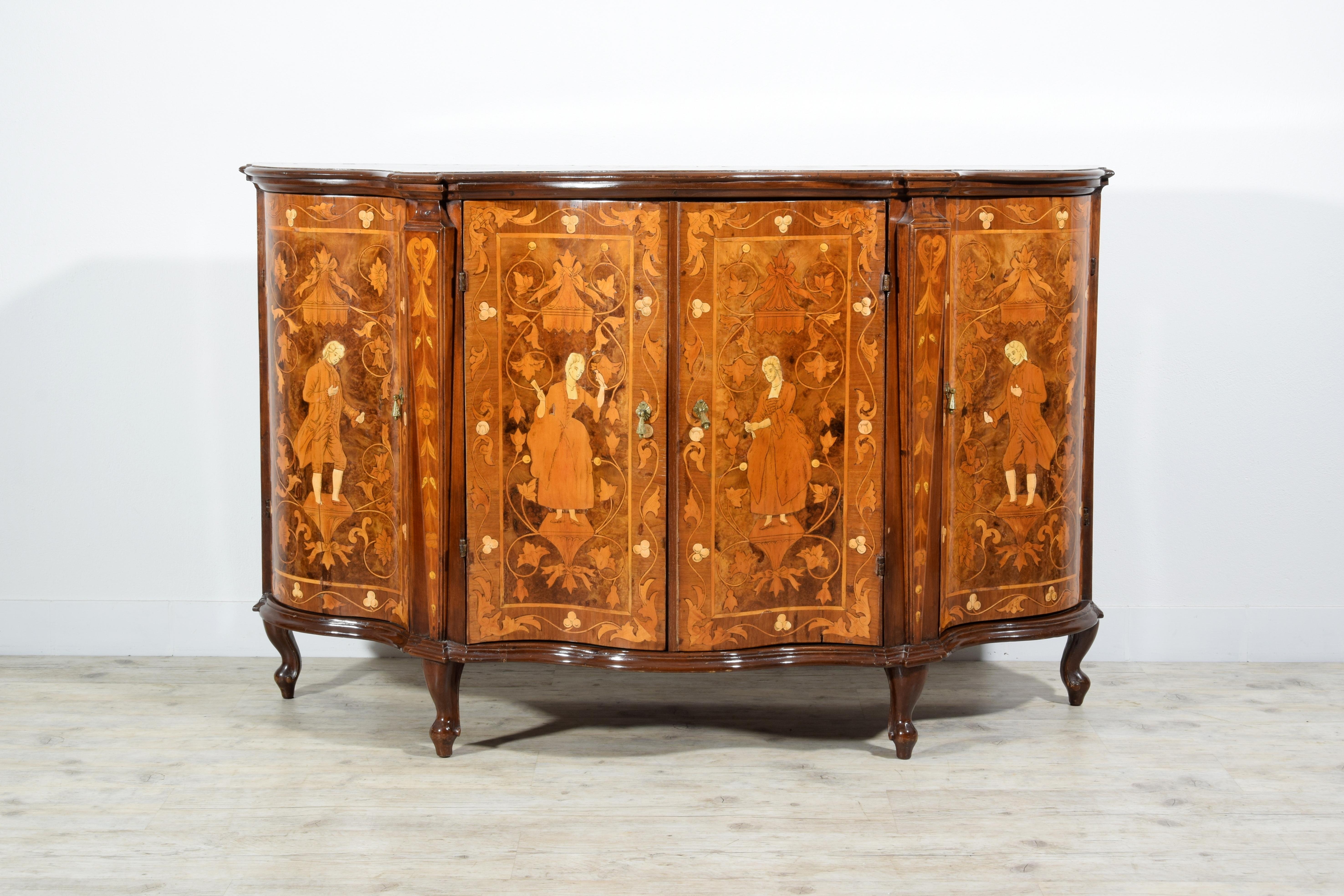19th Century, Italian Rococo Style Inlay Wood Sideboard 

This sideboard was made in the Venetian area in the 19th century. The shaped model takes up the stylistic characteristics of the Venetian Rococo furniture of the eighteenth century. Entirely