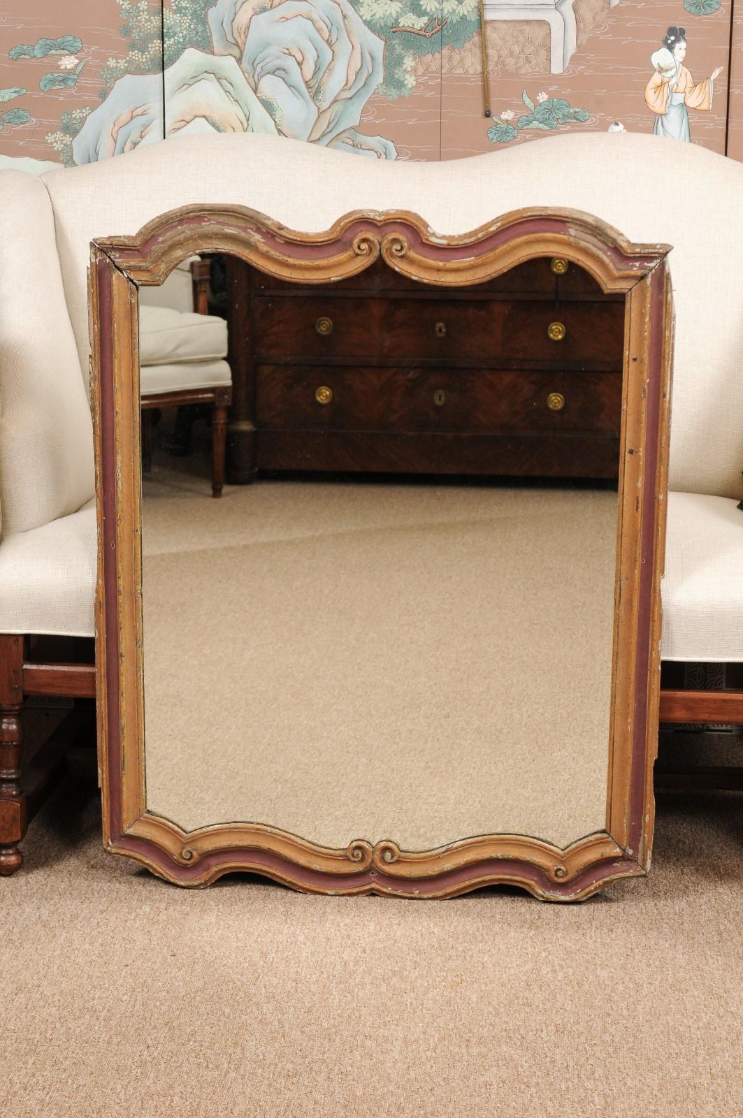 Rococo style burgundy and gold painted frame, 19th century Italy, fitted with new mirror plate.