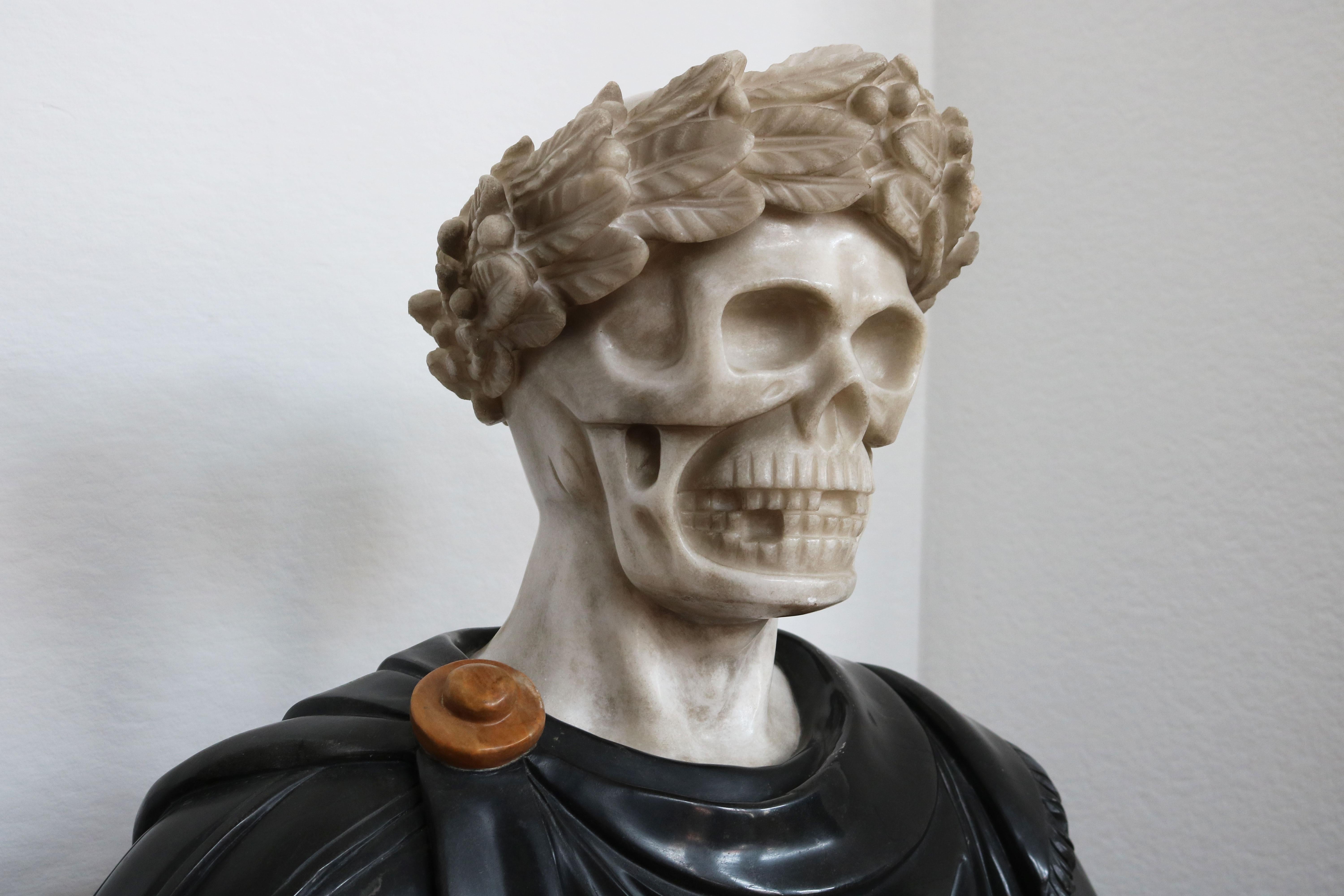 Masterfully carved & most impressive Italian Vanitas bust in solid marble from late 19th century. 
White Carrara marble skull combined with a Belgian Black marble Roman toga (robe). 
The roman toga shows gorgeous detail like curves / folds in the