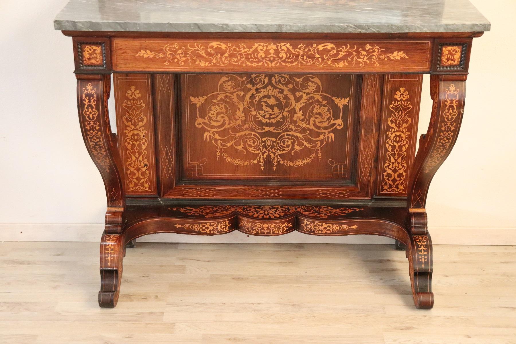 Italian antique console table, 1825s Charles X. Characterized by precious rosewood inlay. Impossible to describe the precious work in inlay in light maple wood. Please look carefully at all the images to understand the high quality of this piece of