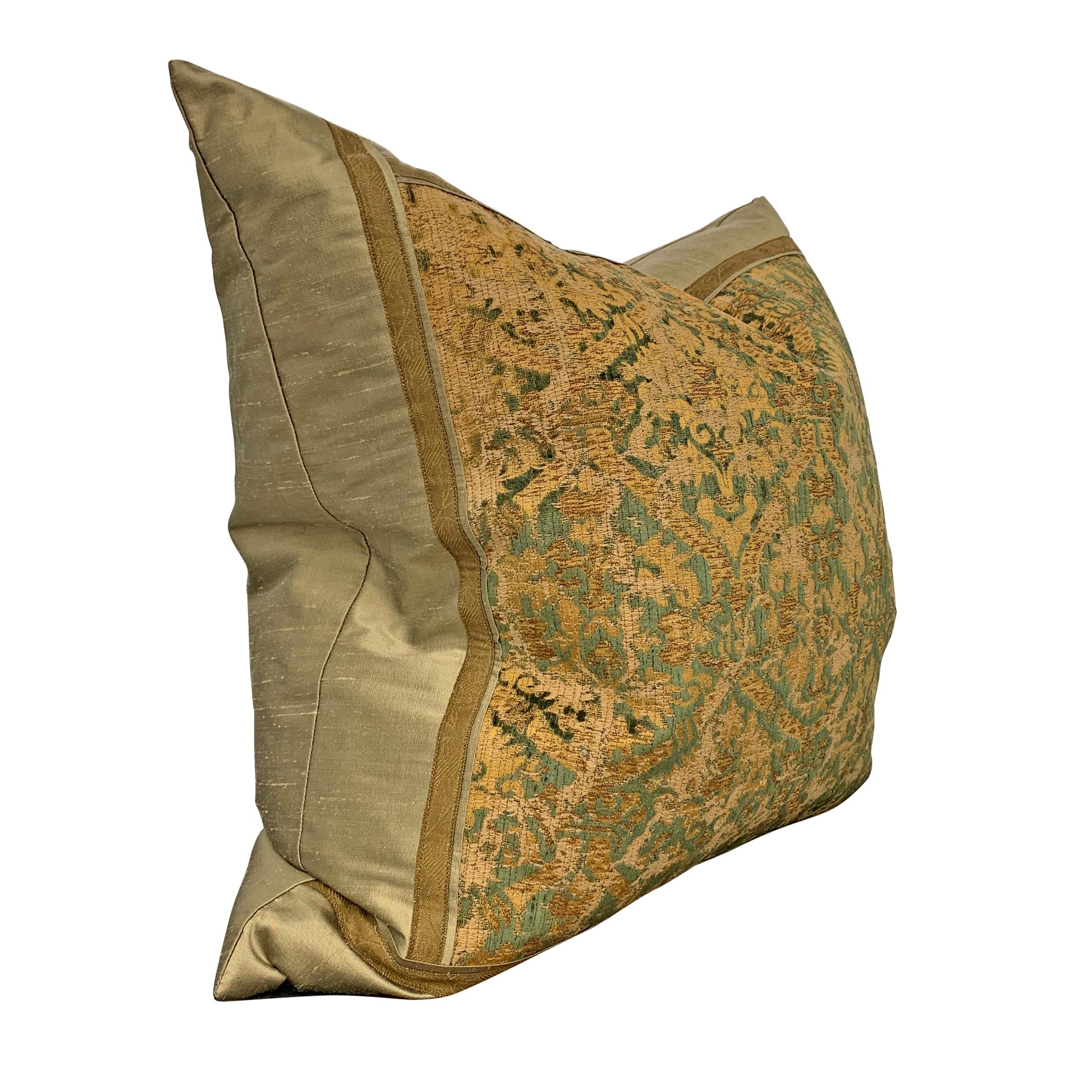 A Grande 19th century Italian silk velvet pillow with a fabulous green and gold damask pattern trimmed with antique gold thread trim, and mounted in new silk. Filled with down.