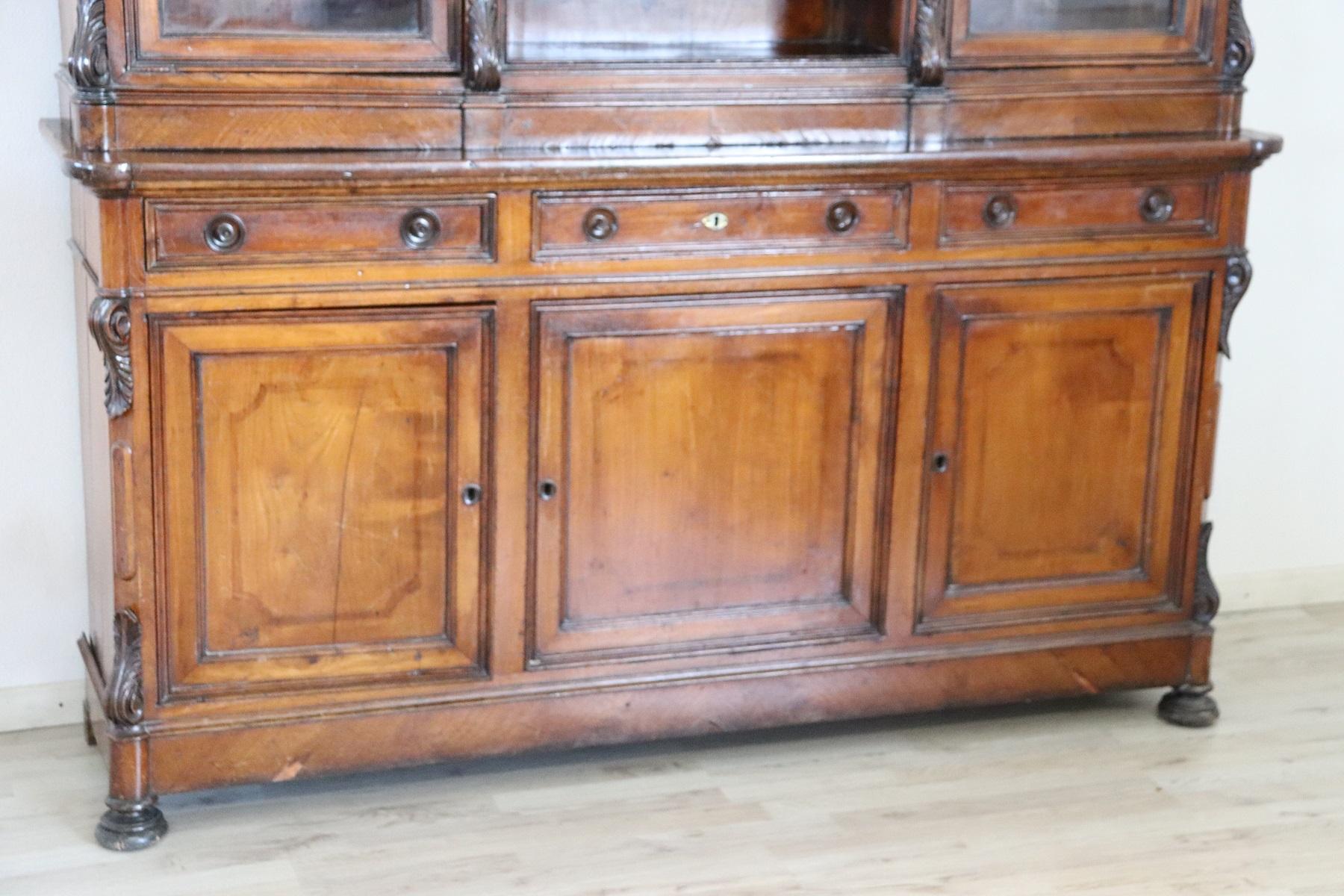 Antique Italian double body sideboard 1880s in solid cherrywood of a beautiful antique patina ! Refined hand carved decoration in wood. Large internal useful space. Beautiful majestic line. It is divided into two parts for a practical transport.