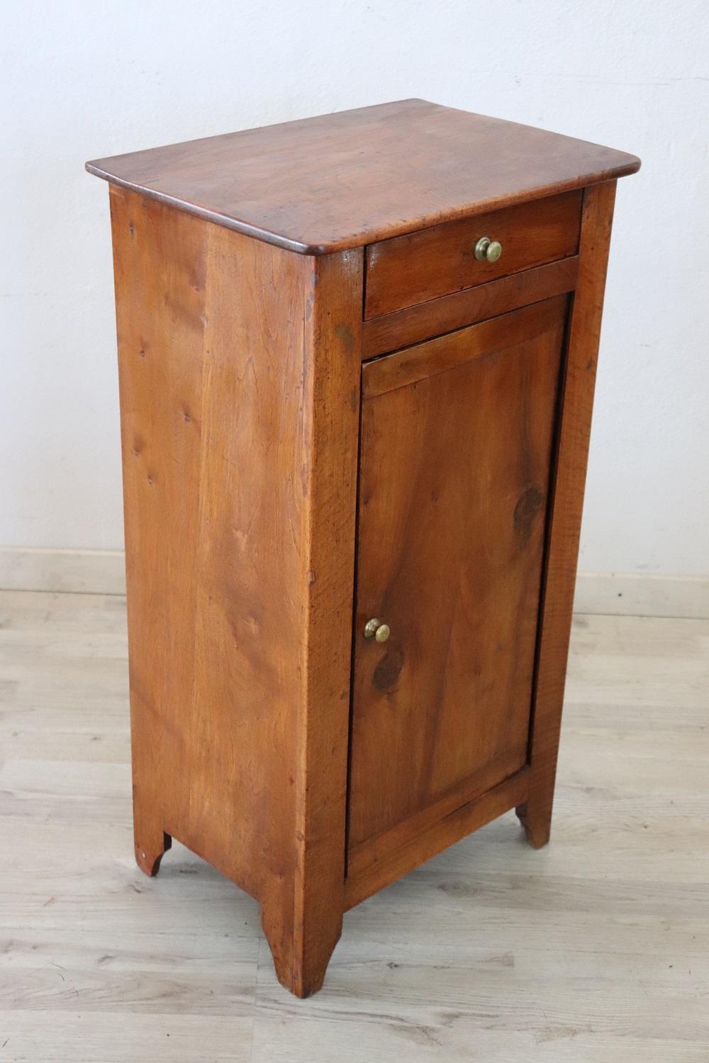 Lovely antique Italian nightstand of the period 1880 in solid walnut wood. The nightstand very refined linear and elegant. On the front one-drawer and one-door Very elegant ideal in every room of the house. Restored, ready to be inserted in your