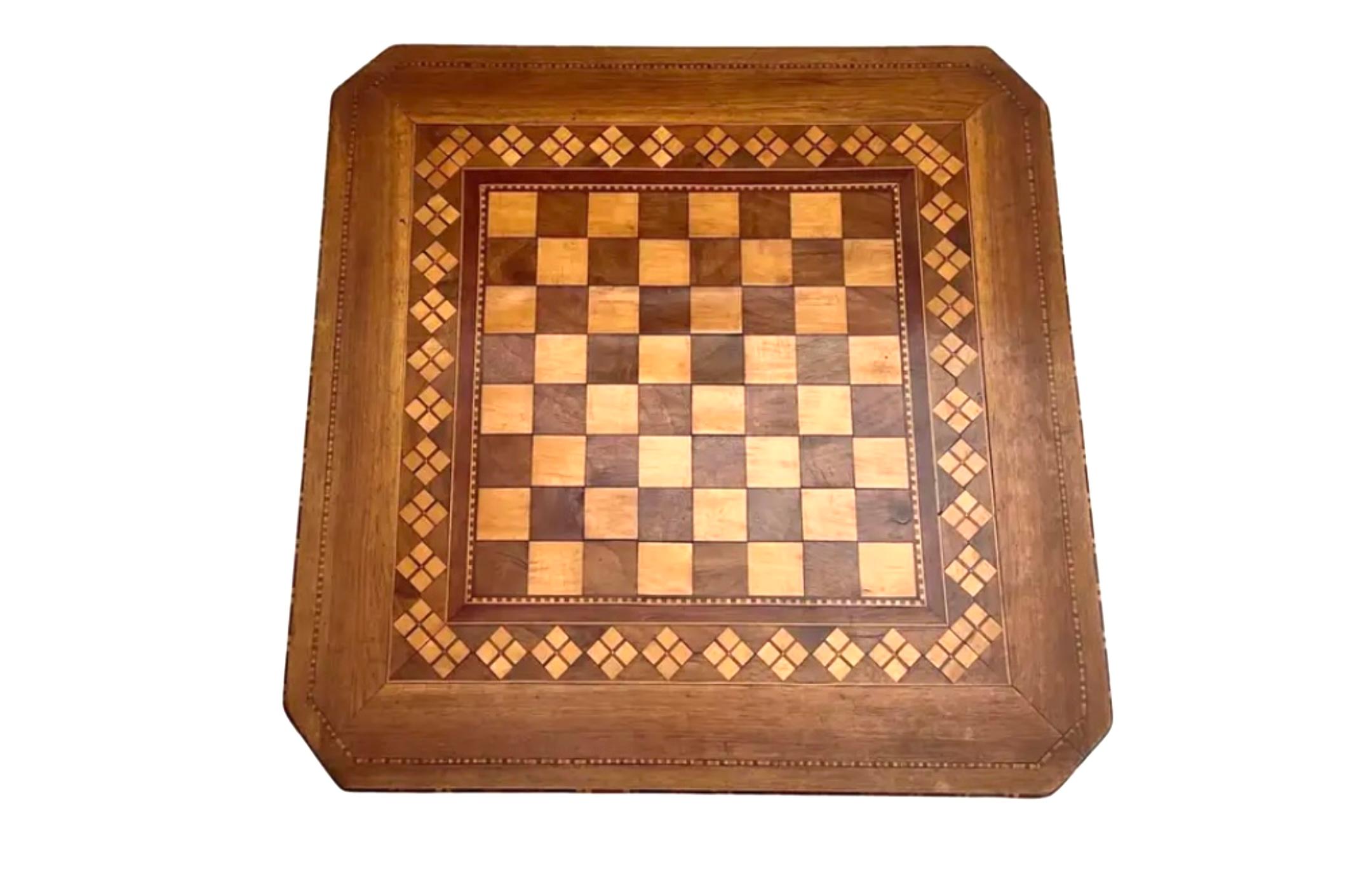 19th Century Italian Sorrento side table. Geometric inlay in checkerboard style, square top with canted corners, standing on turned stem with similarly inlaid scrolled legs. 
