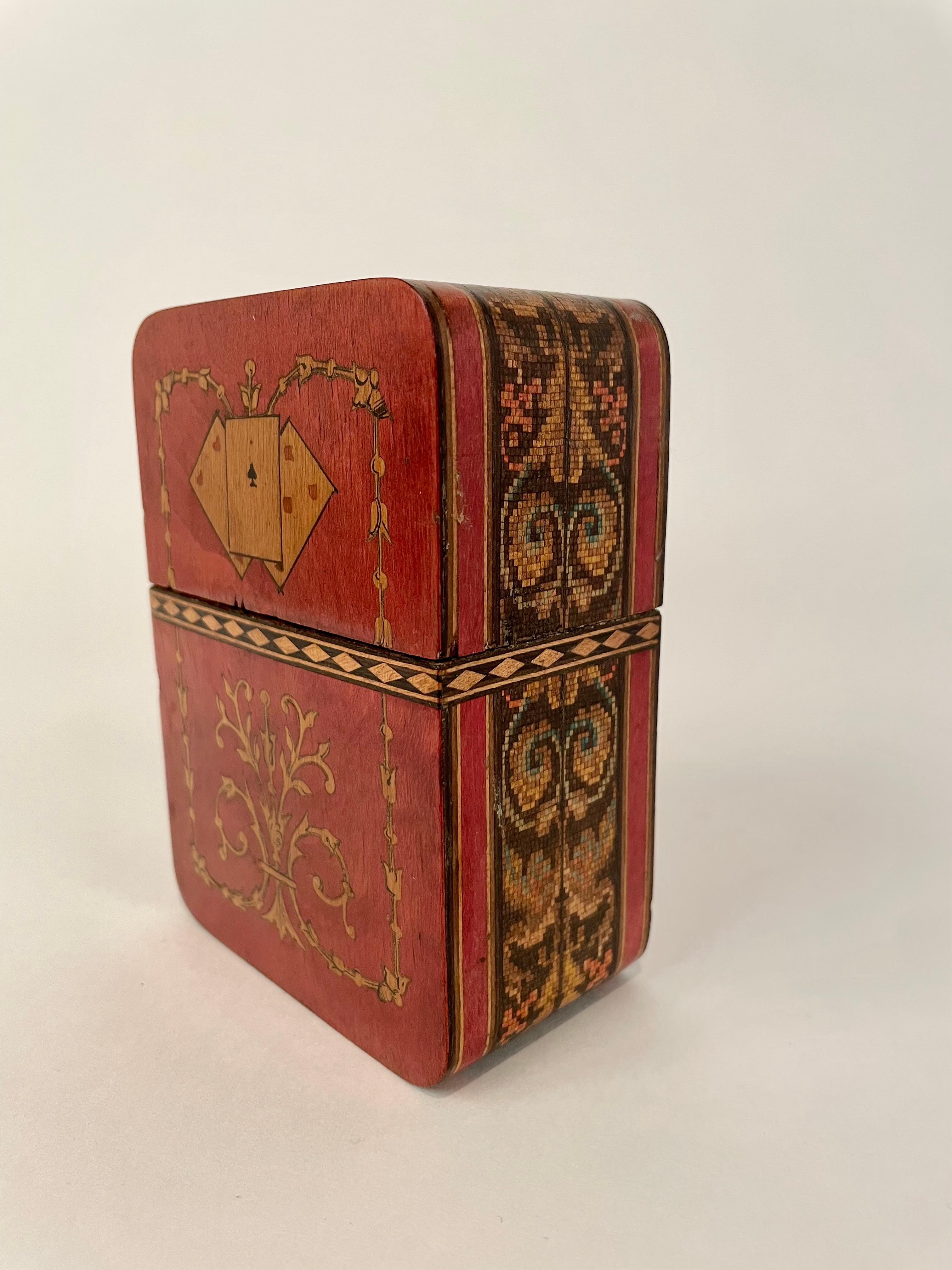 Wonderful and rare 19th century Italian olive wood and various fruit woods and hard woods playing card case. Intricate inlaid designs of cards on front and back, a diamond border and floral arabesques below. With exquisite mosaic running completely