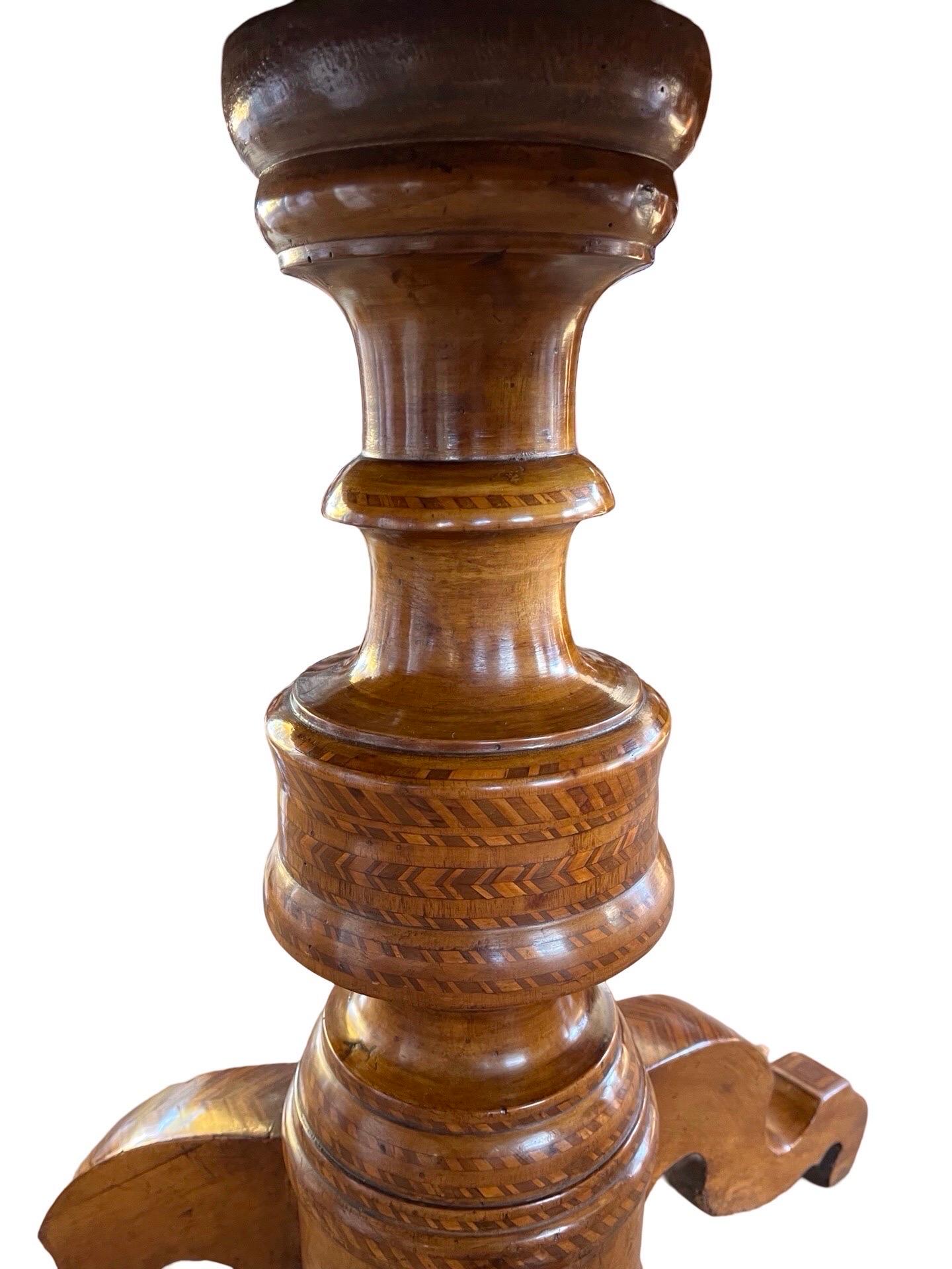Sorrento table hand-made in Italy in the early 1800s using walnut and decorated with fruitwoods geometric inlay. The table features beautiful, radially arranged, geometric veneer done with satinwood and fruitwood as well as book-matched walnut