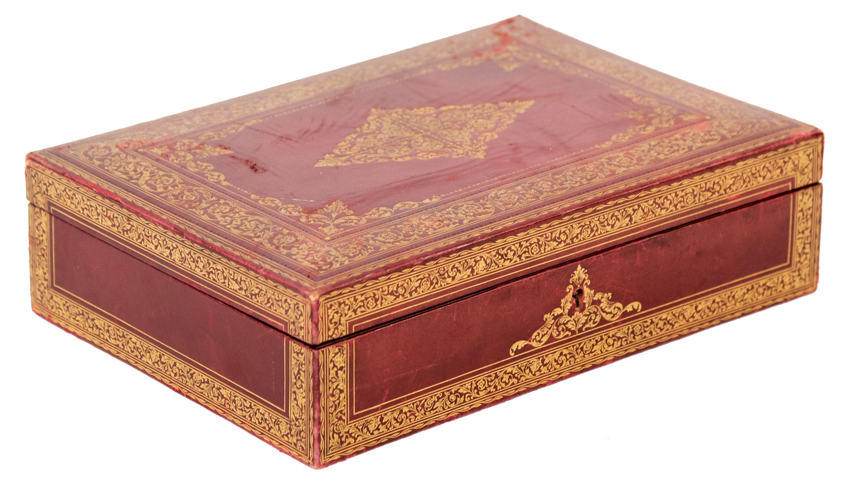 19th century Italian stamped and gilt red leather box with Suede interior.