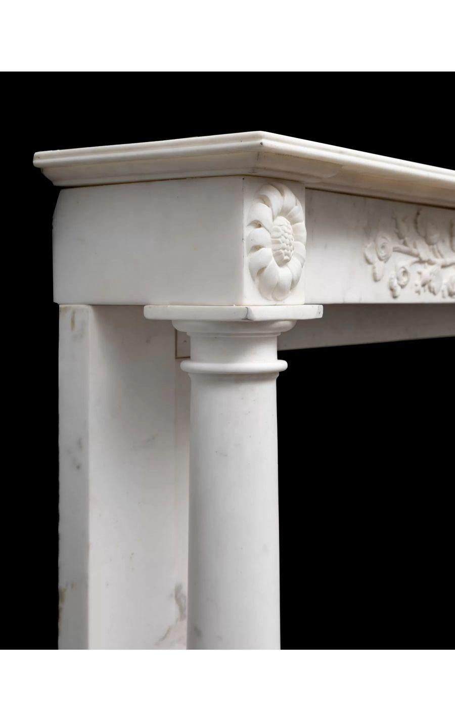 An antique Regency period Italian Statuary marble mantlepiece of fine quality.

Small in scale and beautifully made in Italy during the 1820’s, from the finest statuary marble.

The exquisitely carved frieze and end-blocks supported on Doric columns