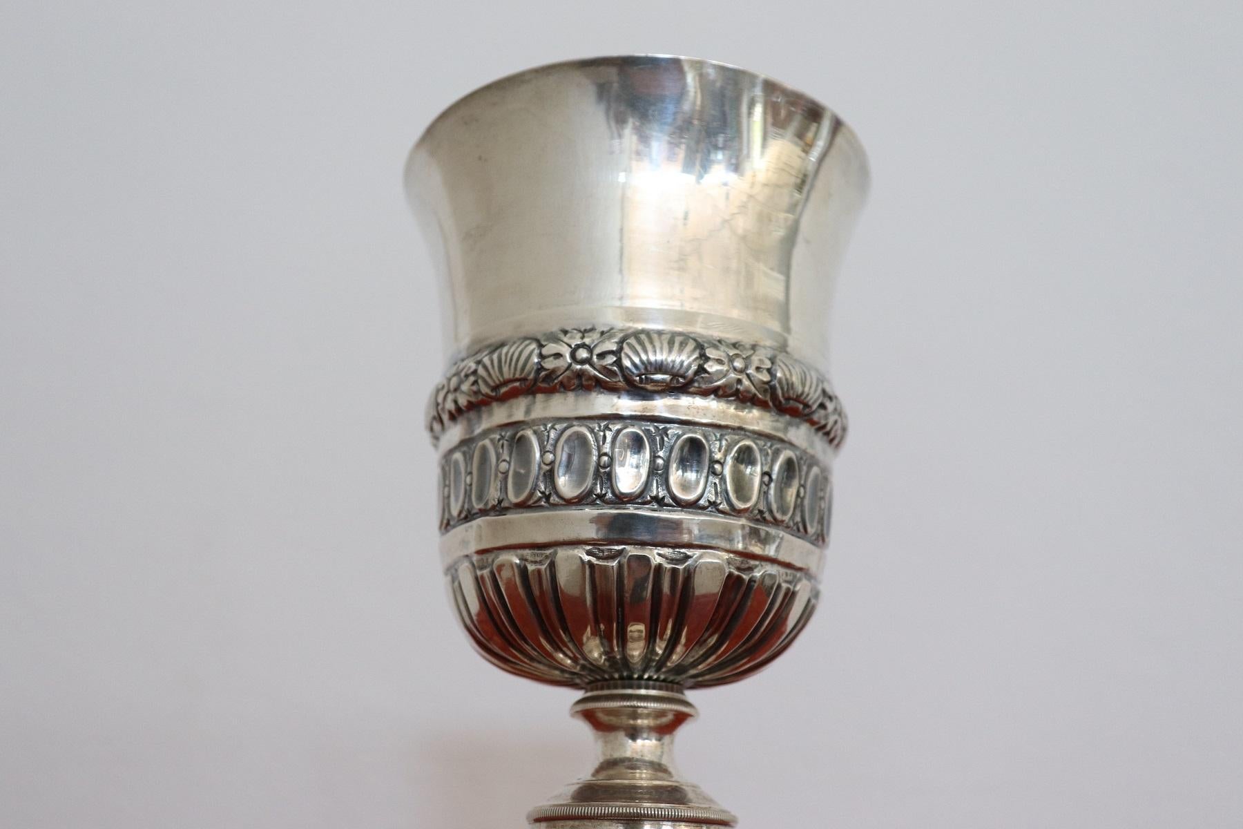 Artwork of great artistic collectible value. Religious chalice in embossed and chiselled silver marks Naples first half of the 19th century. On the cup present in fact the mark with the cross and the letter N and the number 8 in square form, this