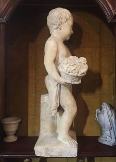19th Century Italian Stone Sculpture of a Putto Holding a Basket with Flowers