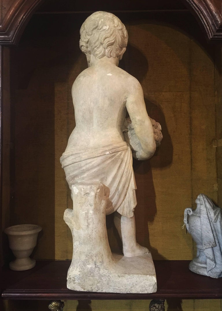 19th Century Italian Stone Sculpture of a Putto Holding a Basket with