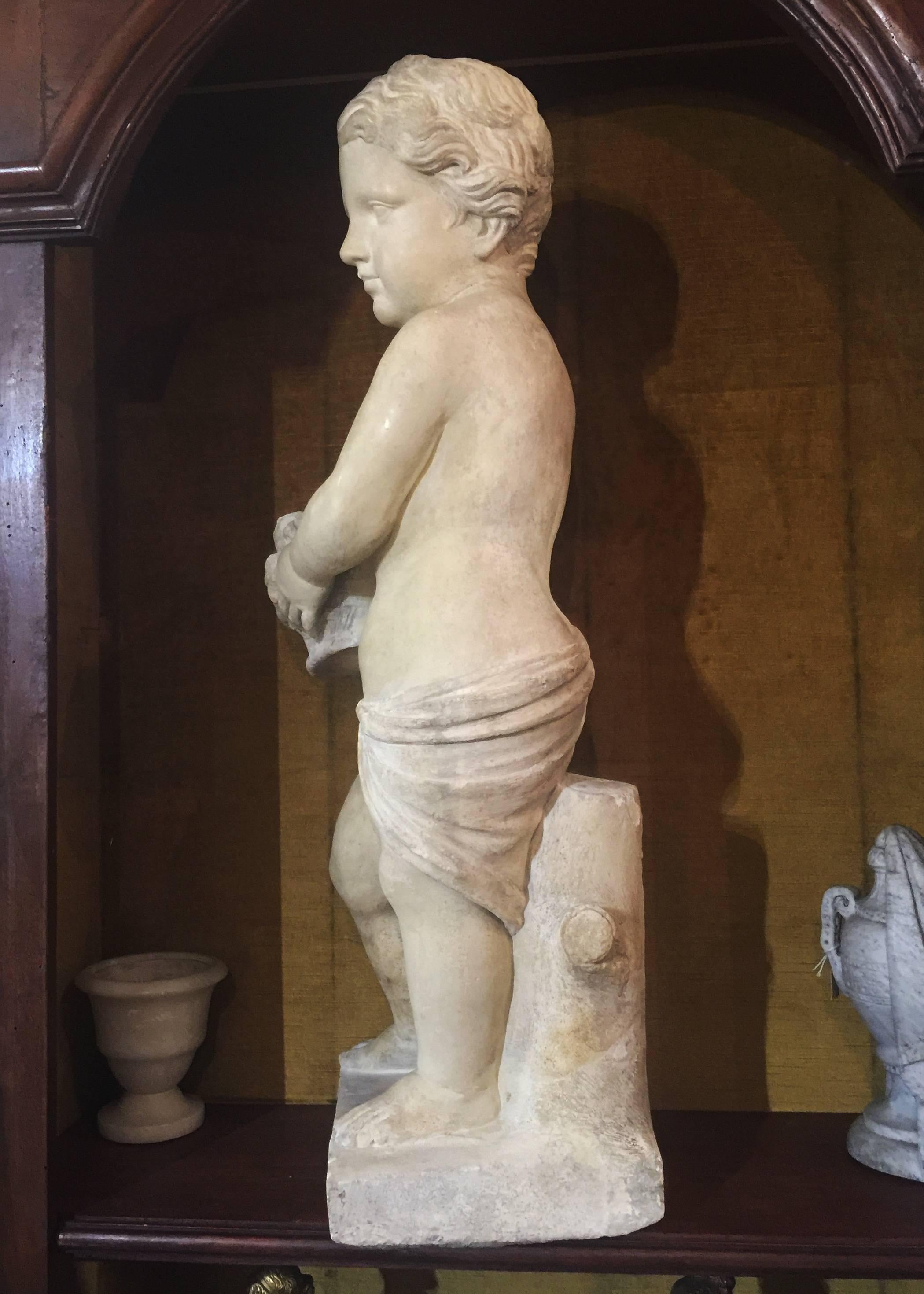 Hand-Carved 19th Century Italian Stone Sculpture of a Putto Holding a Basket with Flowers For Sale