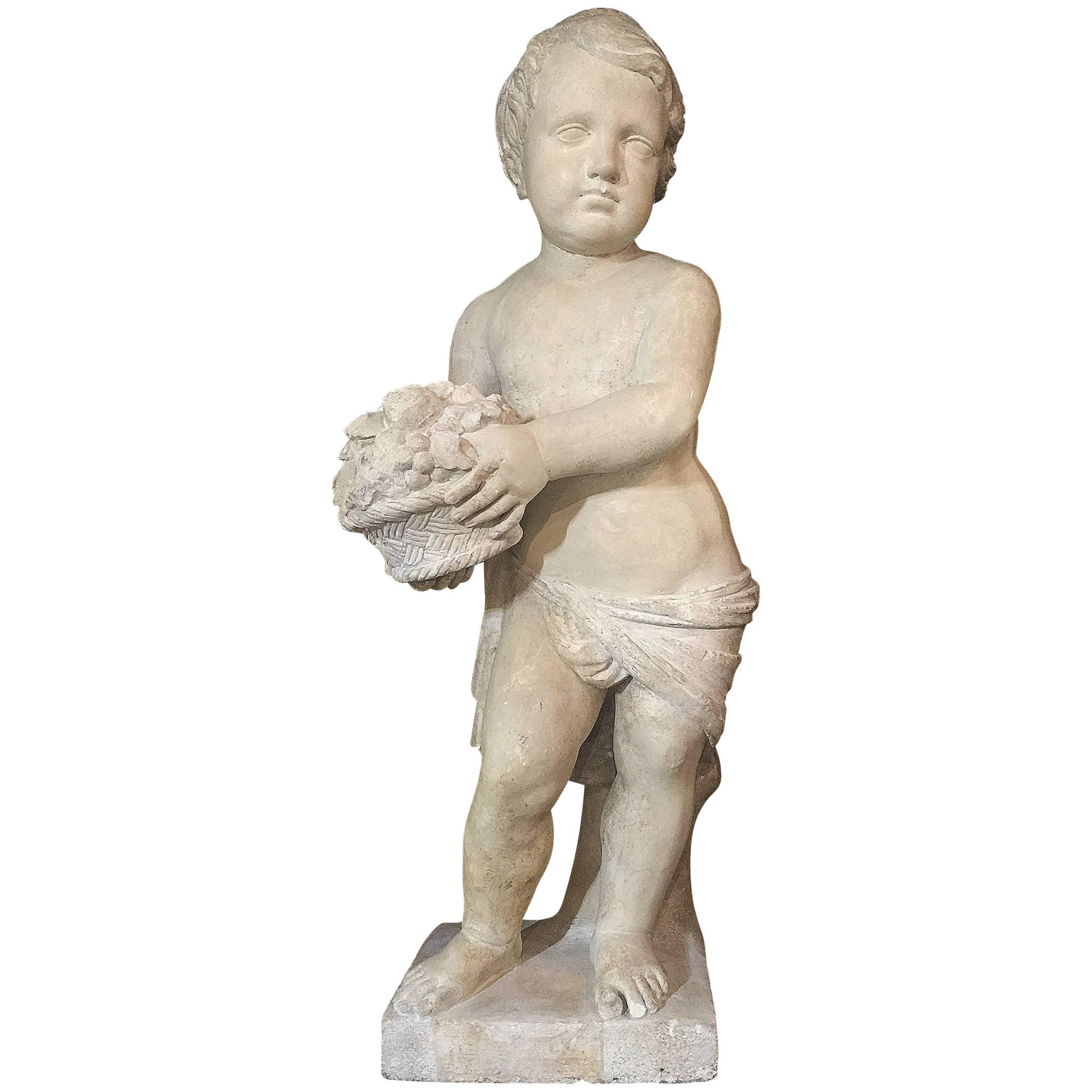 19th Century Italian Stone Sculpture of a Putto Holding a Basket with Flowers For Sale