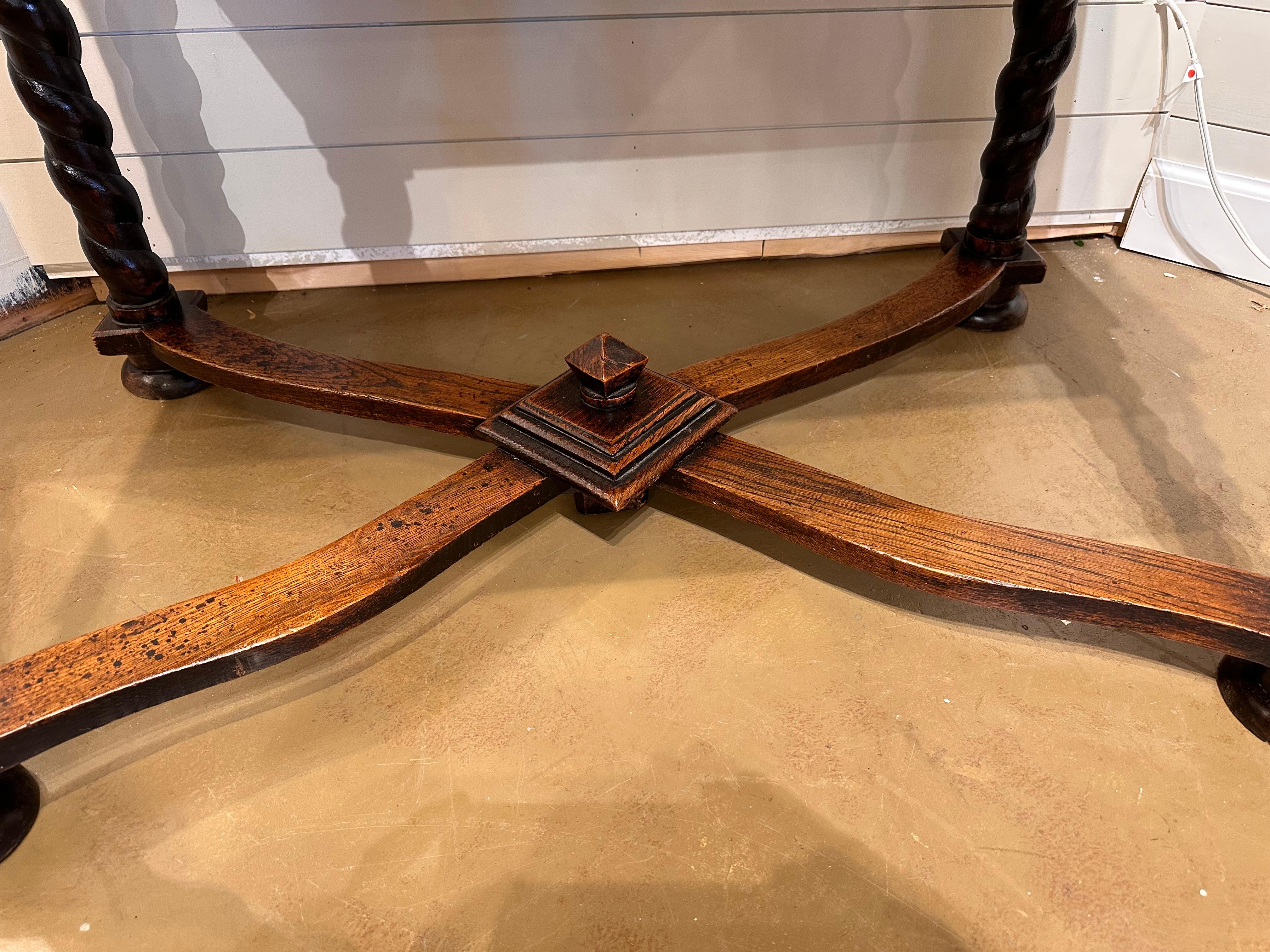 This is an amazing mid 19th century Italian table resting on four gently turned legs with diamond an accent around all four sides so this table could sit in the center of an entryway. Also pay close attention to the stretchers on the bottom the age