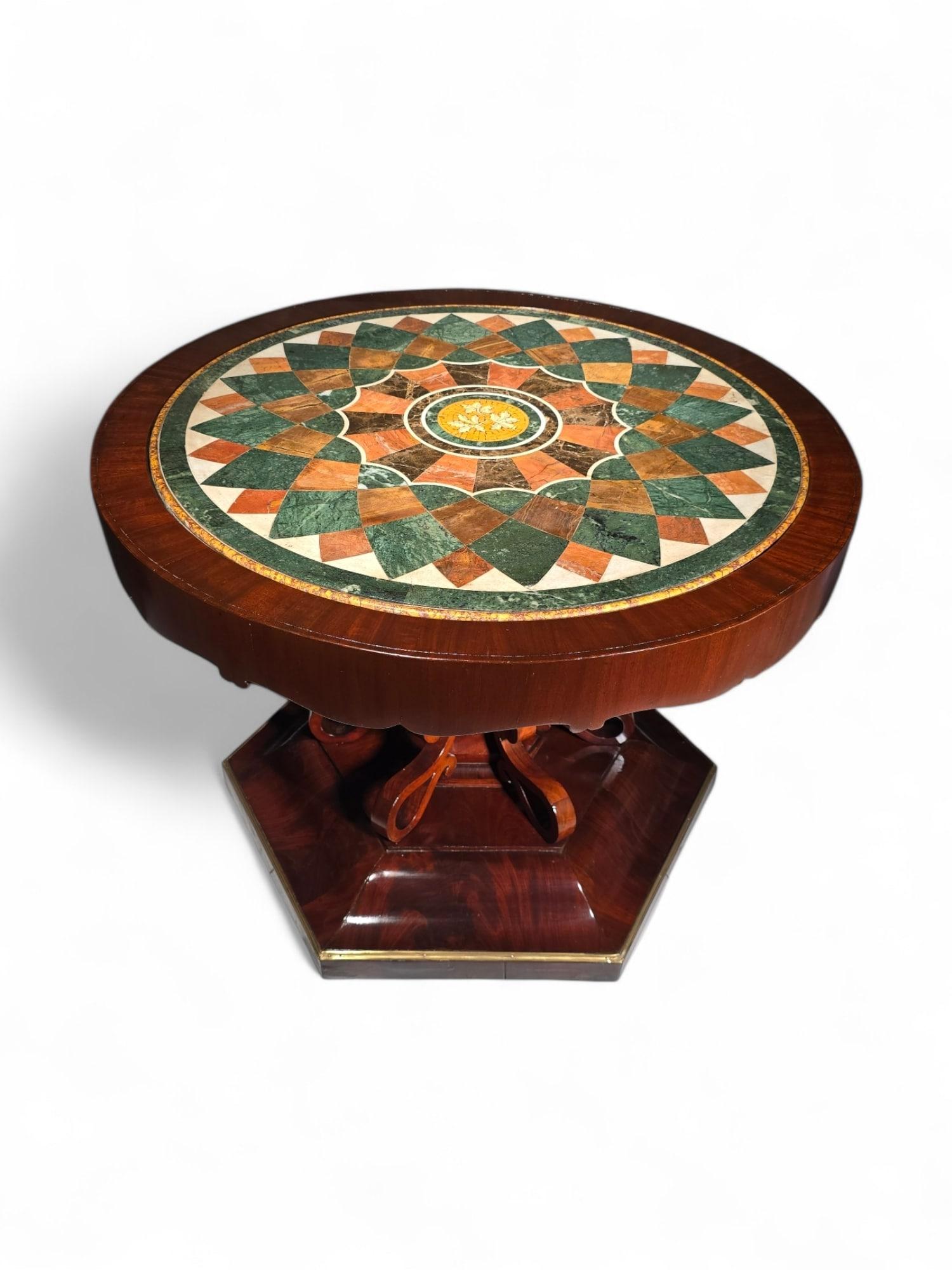 This exceptional 19th-century Italian table, crafted in Naples, is a masterpiece of elegance and craftsmanship. Featuring an exotic wood base paired with a stunning tabletop inlaid with colorful hardstones, this table embodies the artistry and