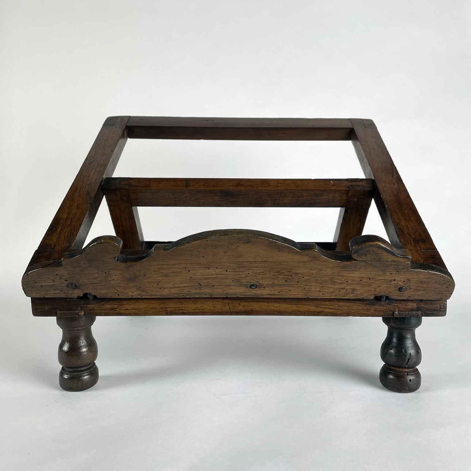 From Italy an early 19th century carved table lectern, an antique rectangular walnut bookstand or music stand on four turned feet. This antique reading bookstand is adjustable and the support allowing the lectern to be placed flat or at different