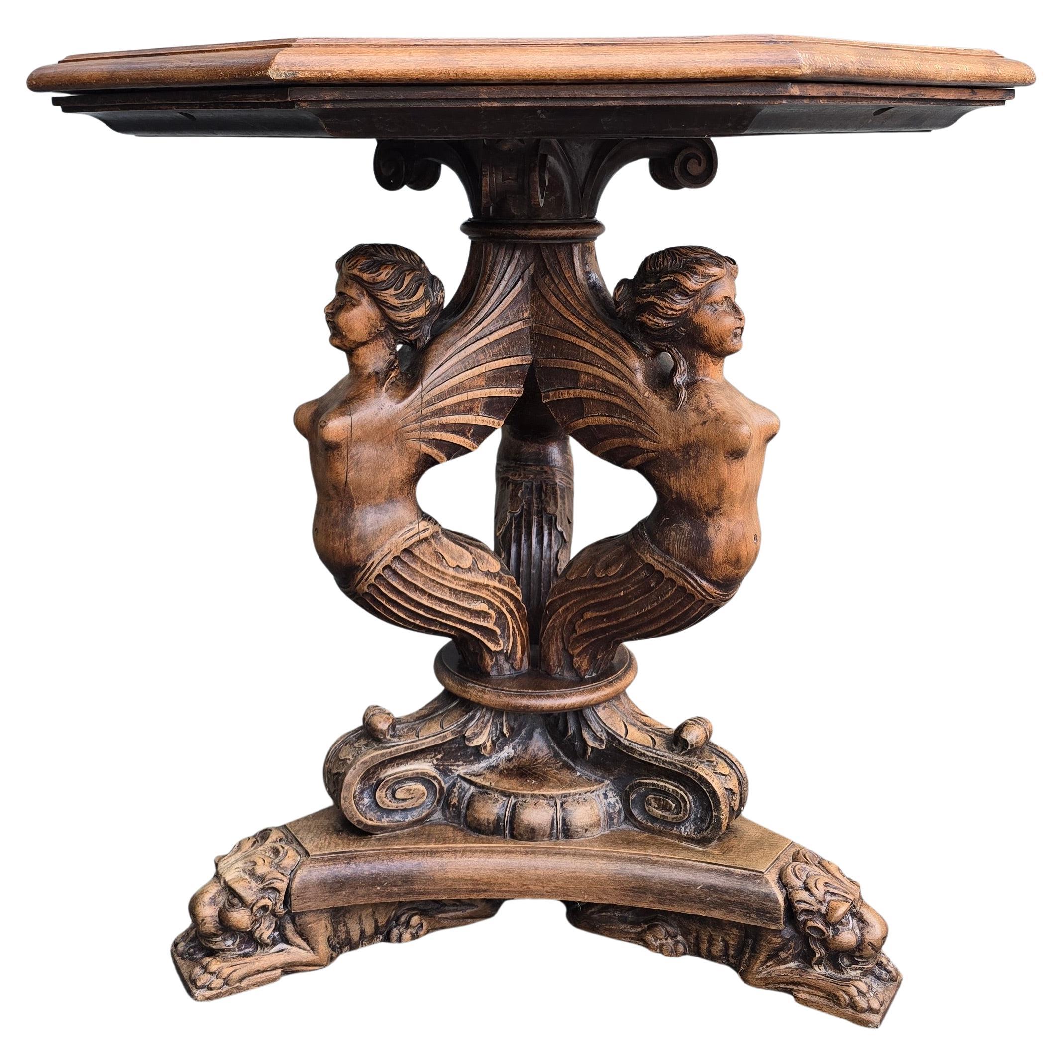 19th Century Italian Table with Carved Female Sphinxes and Lions – Octagonal Top

A highly detailed hand-carved table from Italy, circa 1850–1880. This rare piece blends mythological iconography with masterful woodwork.

The base features three