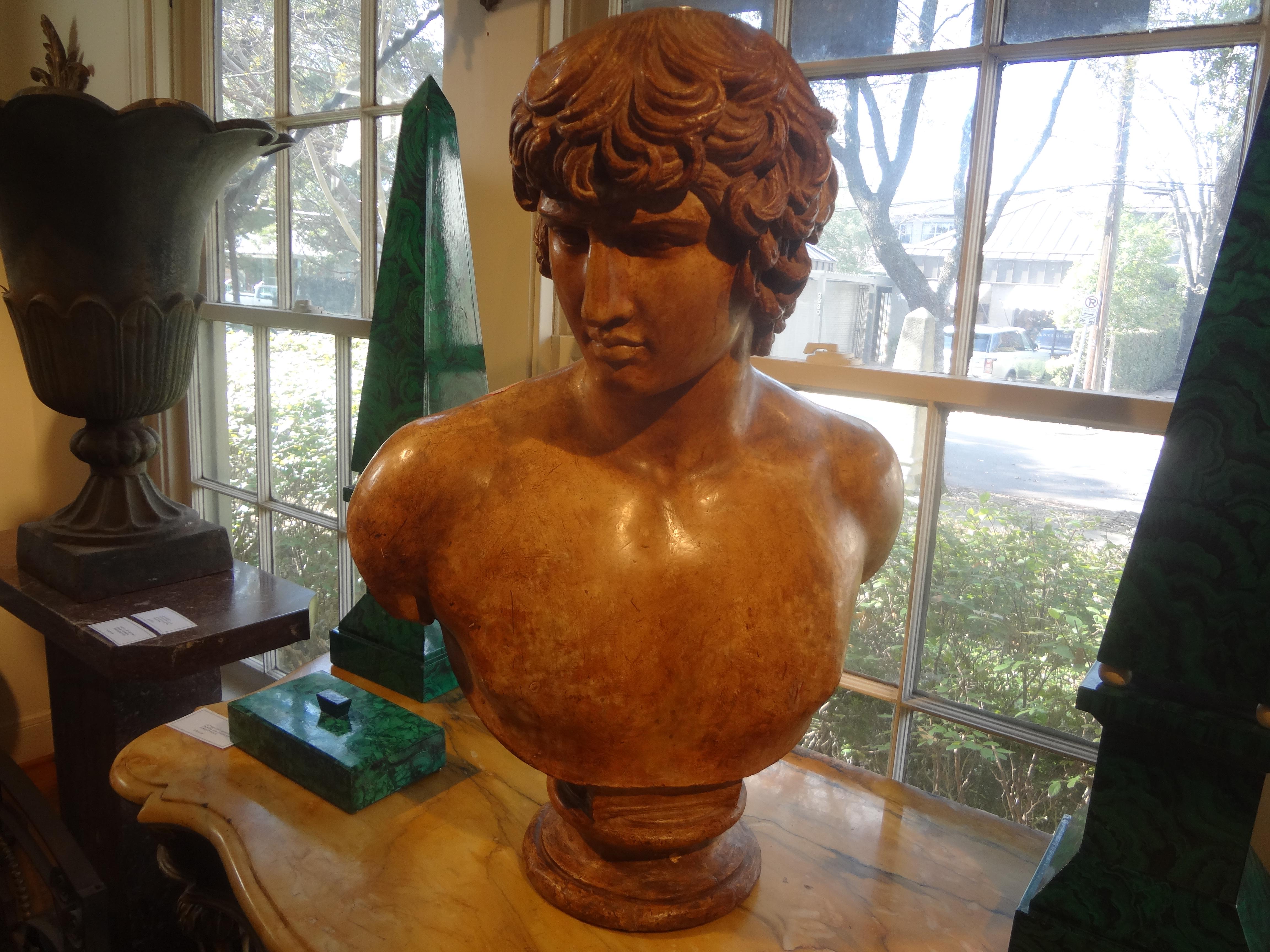 19th century Italian terracotta bust of a classical male.
This monumental antique Italian terracotta bust sculpture of a classical Roman male is a
well executed statement piece and would look great on a pedestal, console table or
credenza.