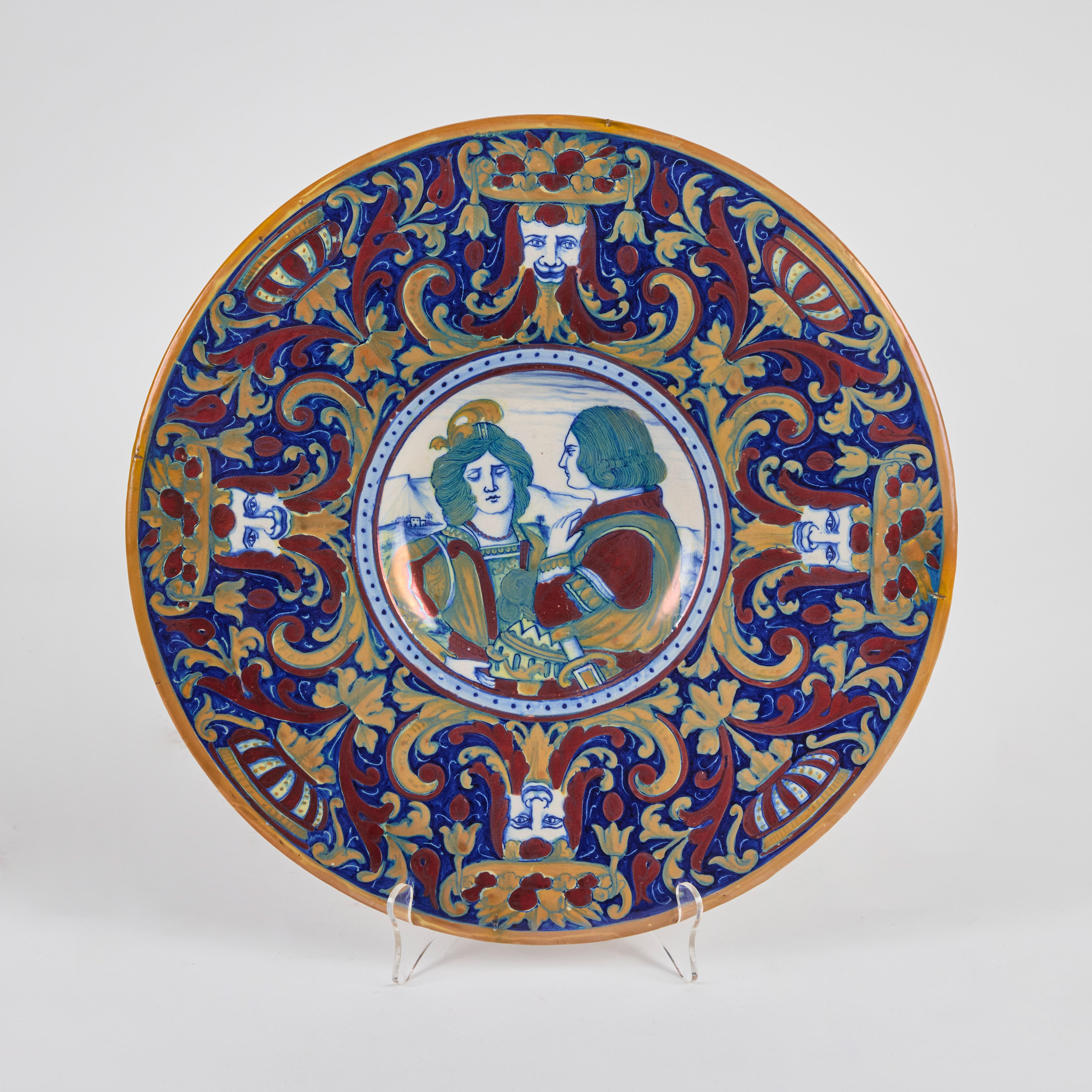 A pair of hand-painted, tin-glazed, ceramic platters from Naples, Italy