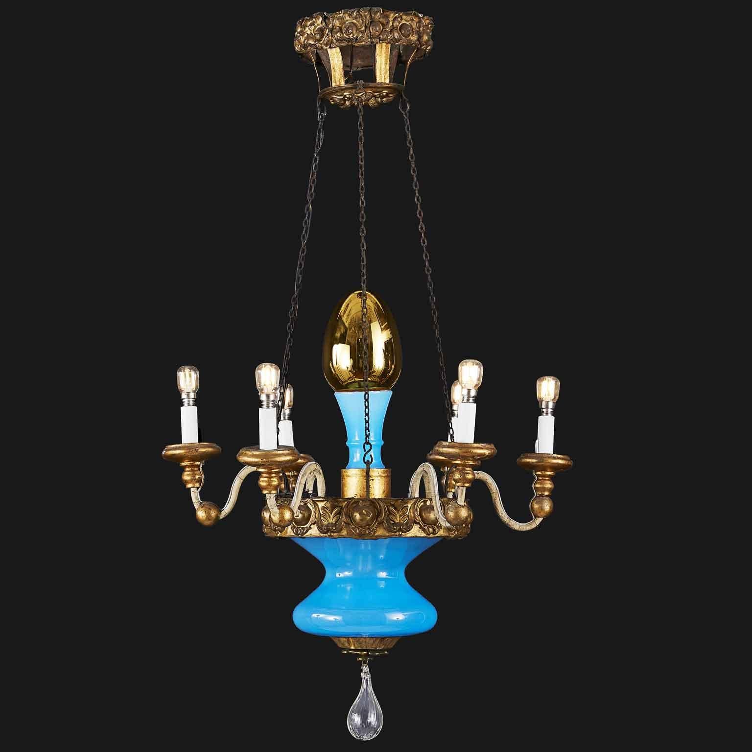 A charming Italian six armed chandelier from Tuscany, Lucca dating back to the late 19th century. In good condition, hand-realized with a very unusual structure, very original and unique. Features a gilded repoussé brass and iron crowns and a lovely