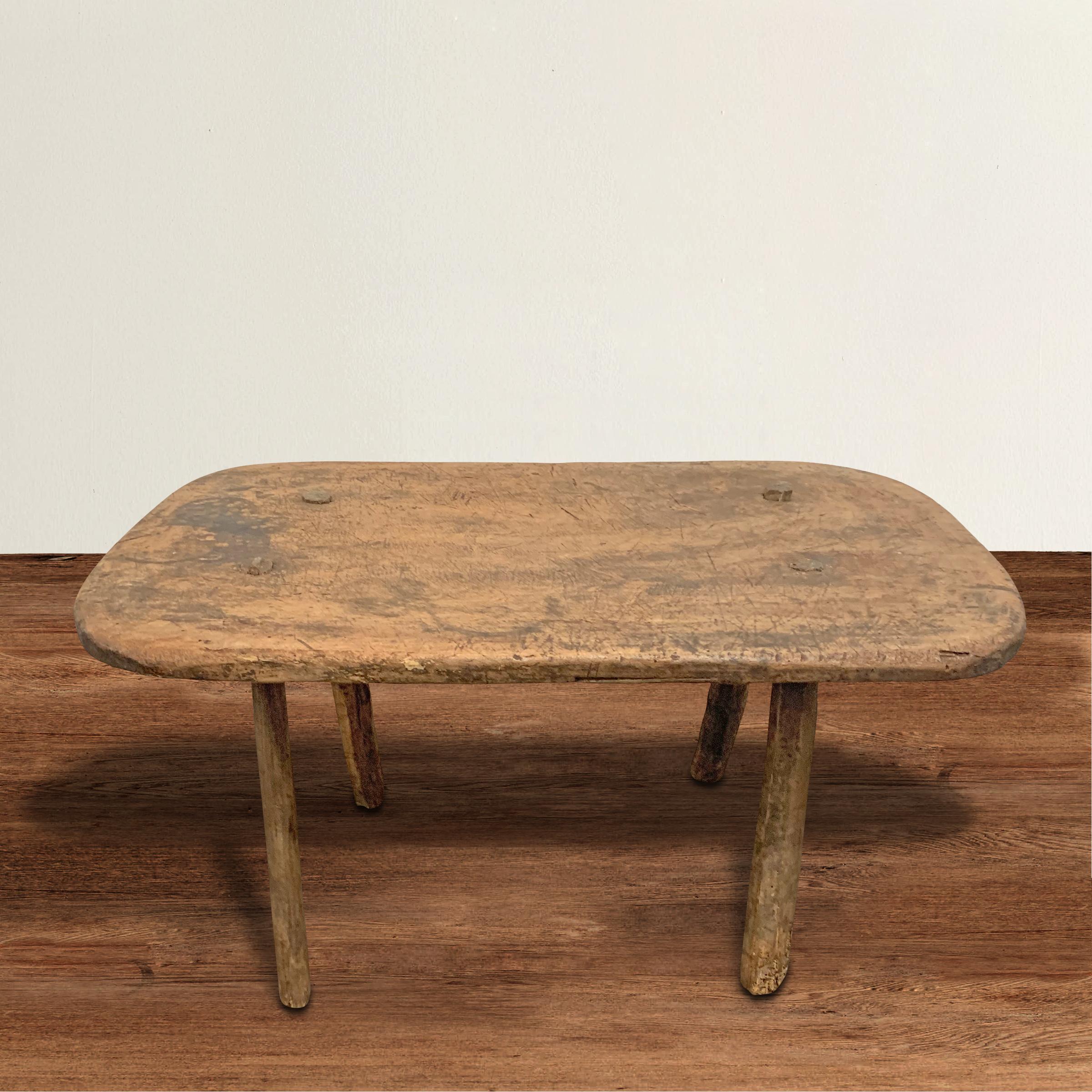 A Classic 19th century Italian Tyrollean walnut low table with through-pegged tapered legs. This table began its life in a rustic chalet in the Tyrollean alps, but now blends seamlessly into any modern or traditional interior.