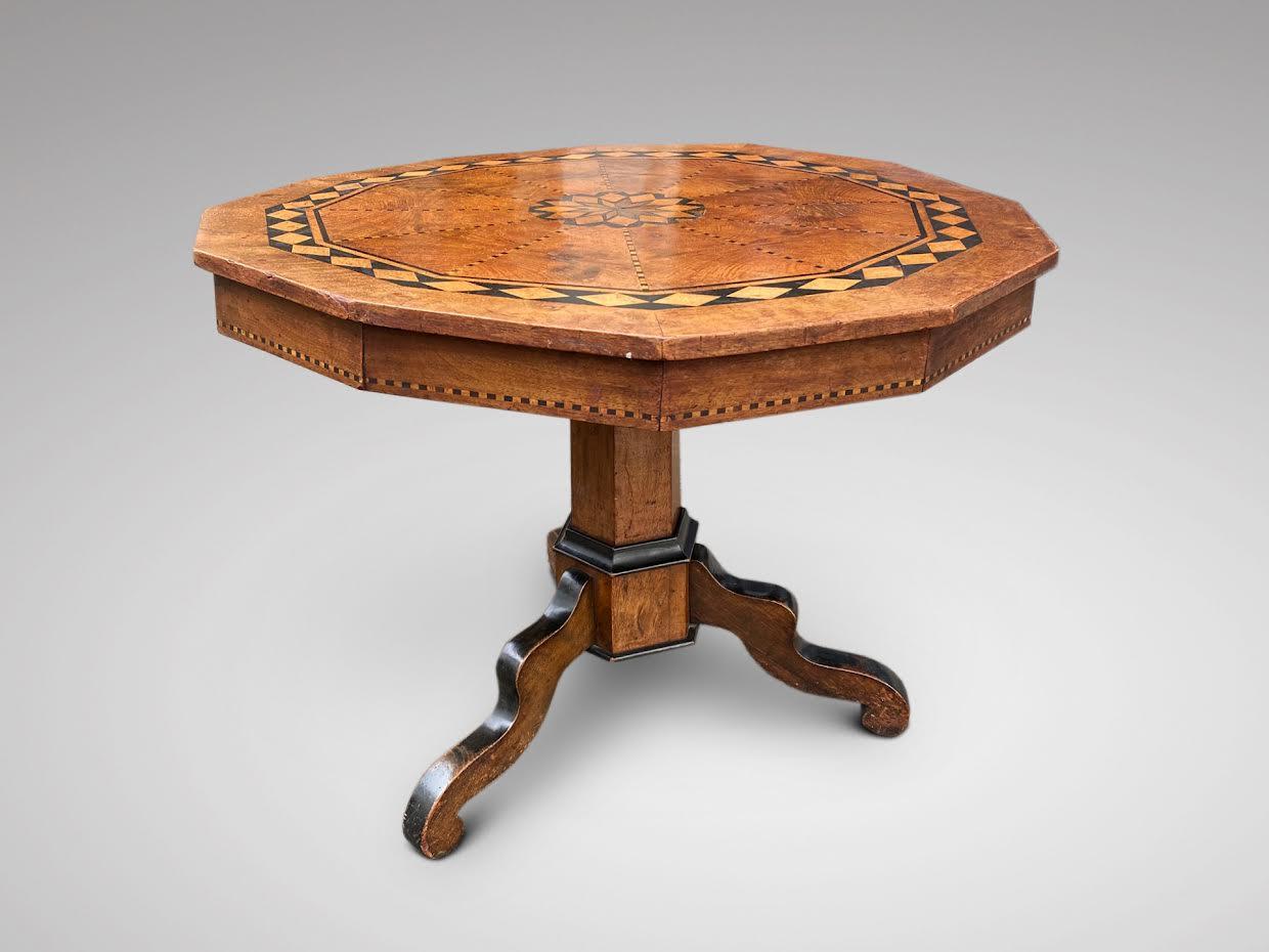 A very pretty 19th century pedestal tripod occasional centre table in fine walnut marquetry and inlay with other warm coloured woods. Satinwood, ebony, kingwood, rosewood. Standing on a pedestal base, divided into three wavy legs. Gorgeous table
