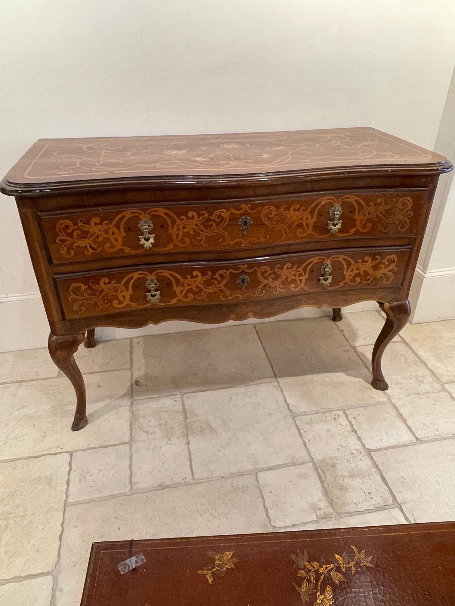 Beautiful 19th century Italian walnut marquetry inlaid commode Lovely pattern on the inlay including floral images. The piece also has 2 drawers for storage. So pretty!!