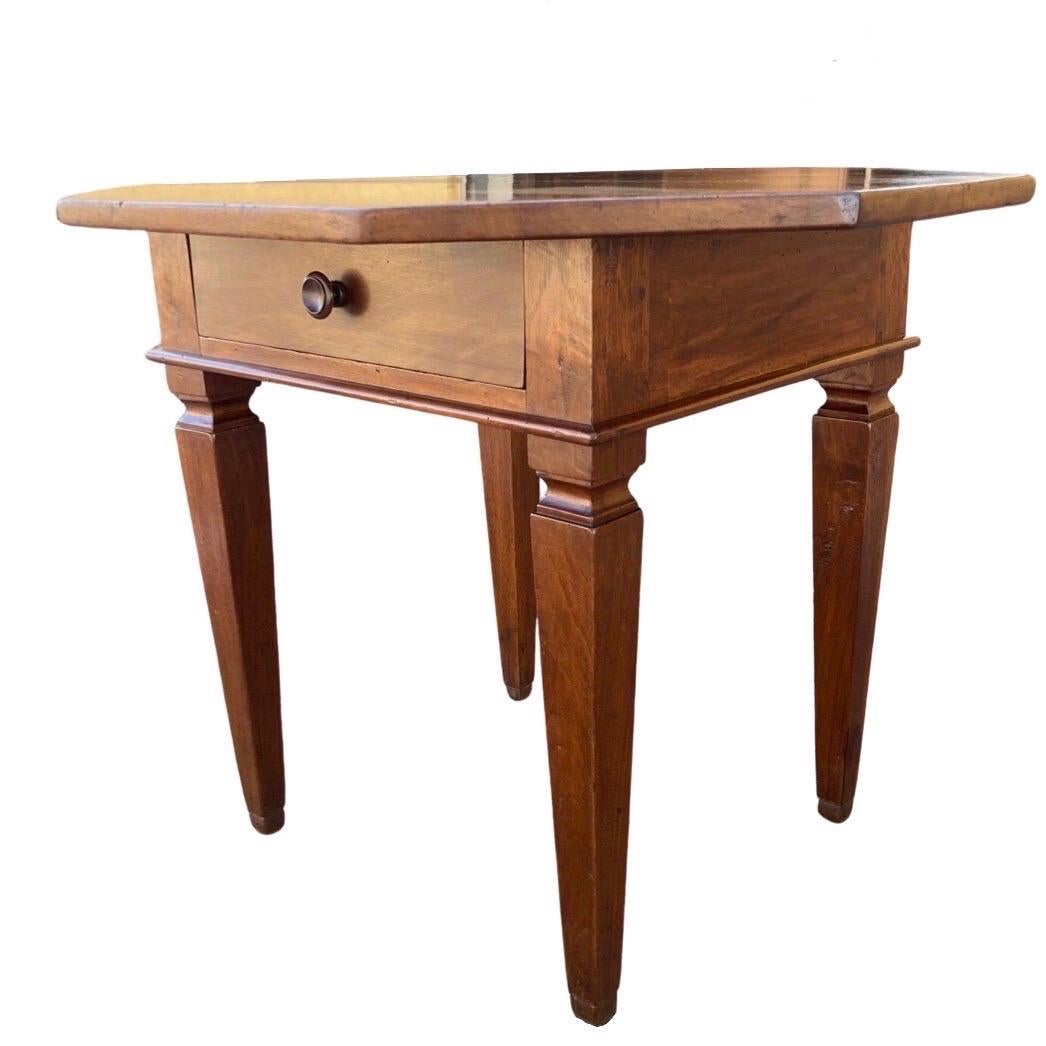 Octagonal Italian side table built in the early 1800s using walnut. This is a very cute and interesting table because of its overall straight lines and warm, yet light, color. The top is made of two large boards with straight edges and cut in the