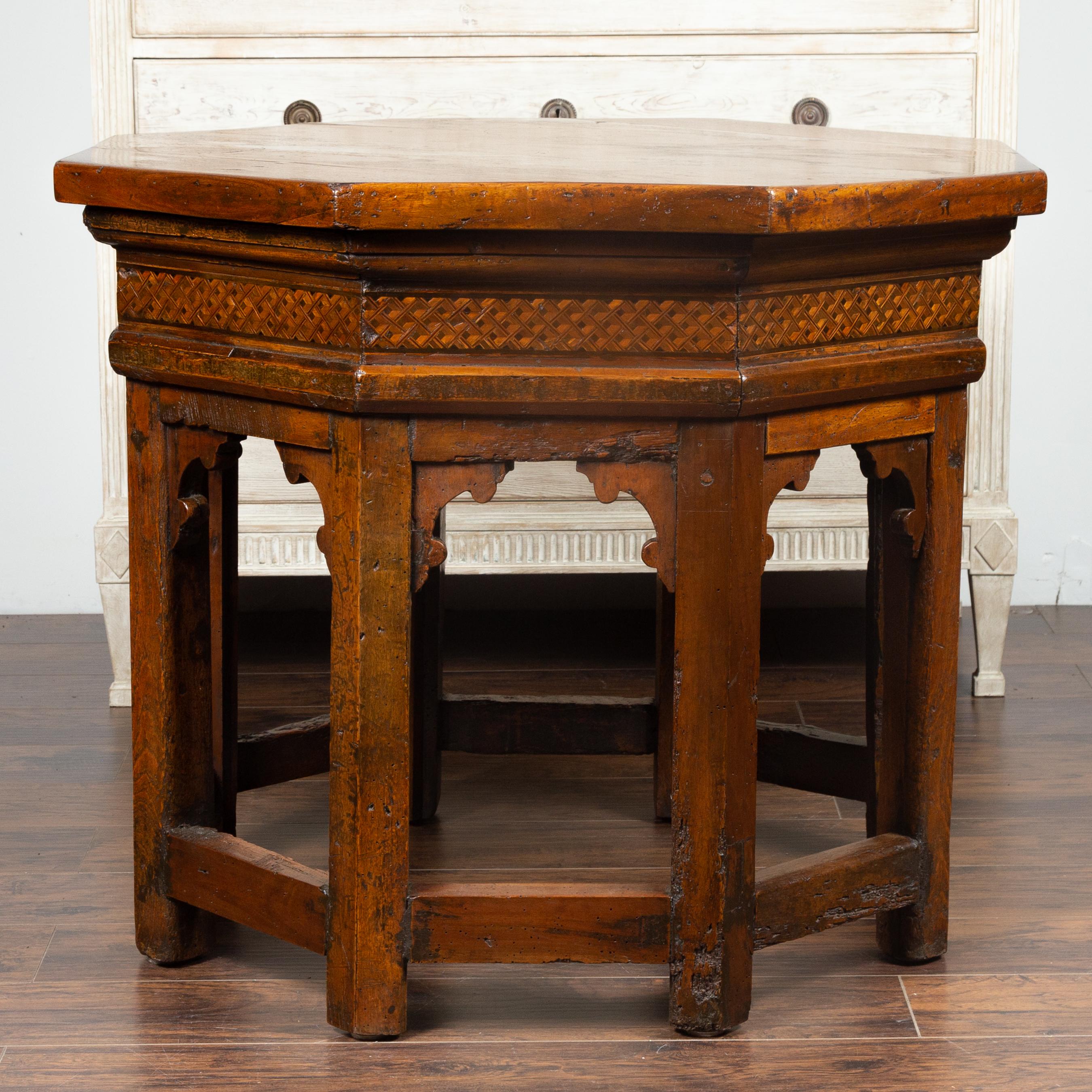 An Italian walnut octagonal center table from the mid-19th century (or earlier), with geometrical inlay. We have a near pair available with slight variations in the dimensions, please check item LU836716746041. Born in Italy during the 19th century,