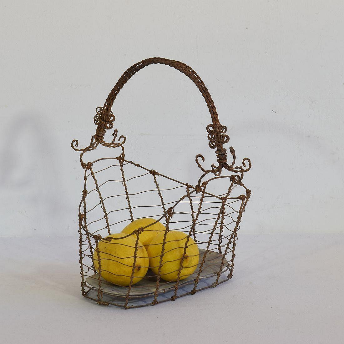 Wonderful and very rare wirework basket with a great form.
Iron and zinc
Italy, circa 1850-1900
Weathered.