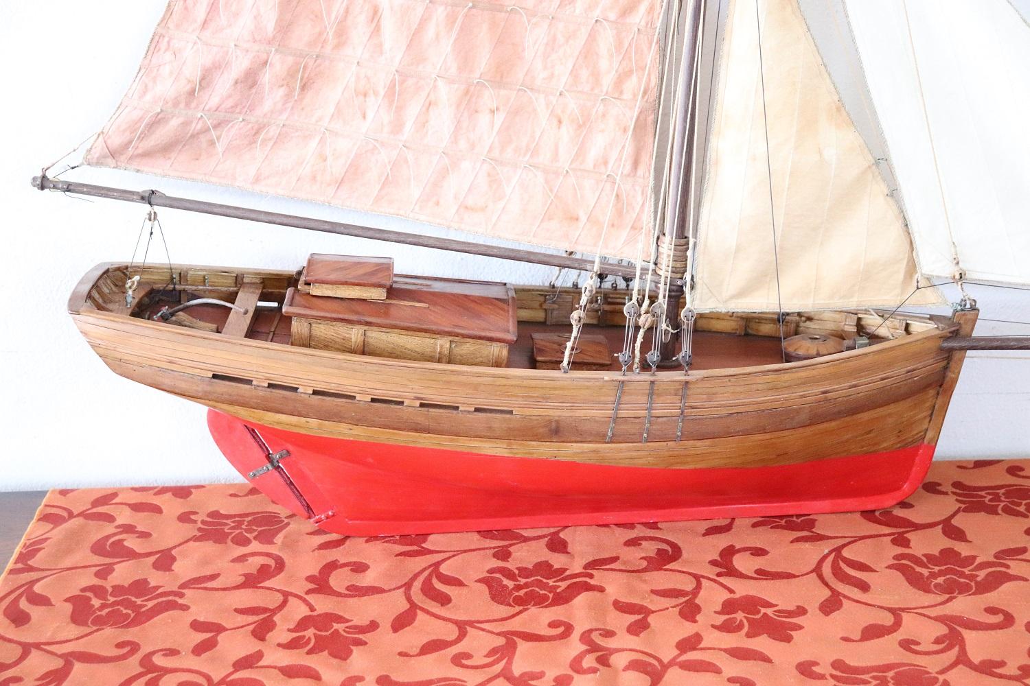 Model sail boat made by hand of wood and canvas, 1940s.
