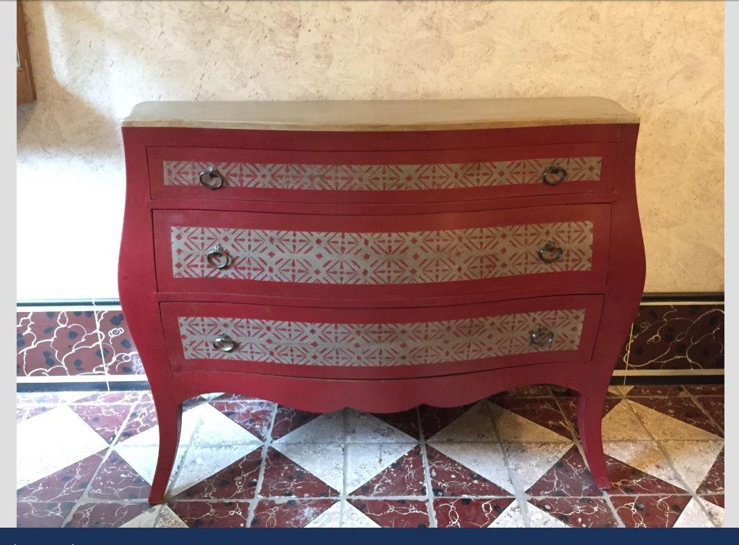 19th century Italian wooden chest of drawers with geometrical decorations and brass handles.
 