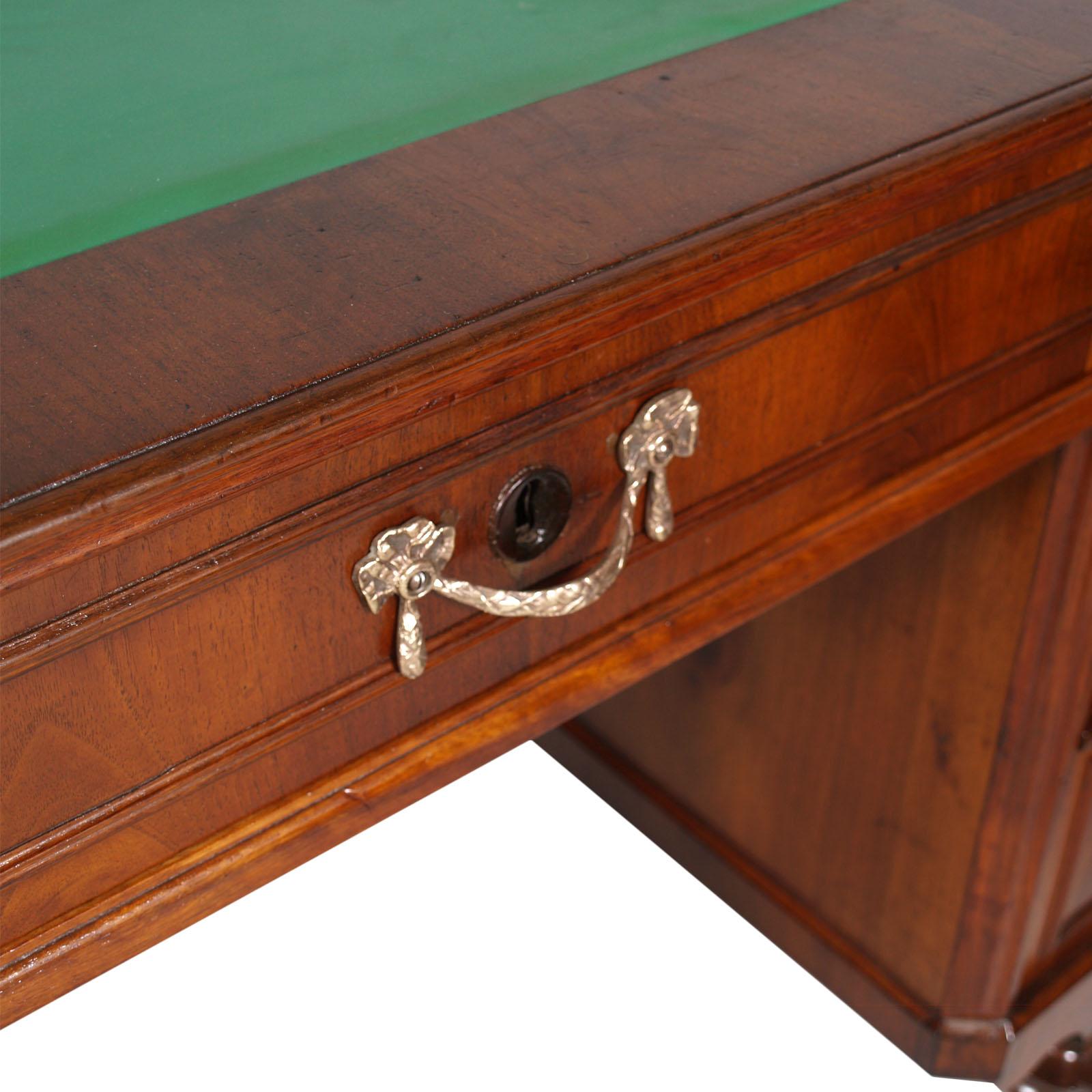 Mid-19th century Italian writing desk in solid blond walnut and weneer walnut, restored and finished with shellac and wax; new top in real leather.
Bottom of the drawers and back of the desk in solid fir.

Measures cm: H 93, W 126, D 63.