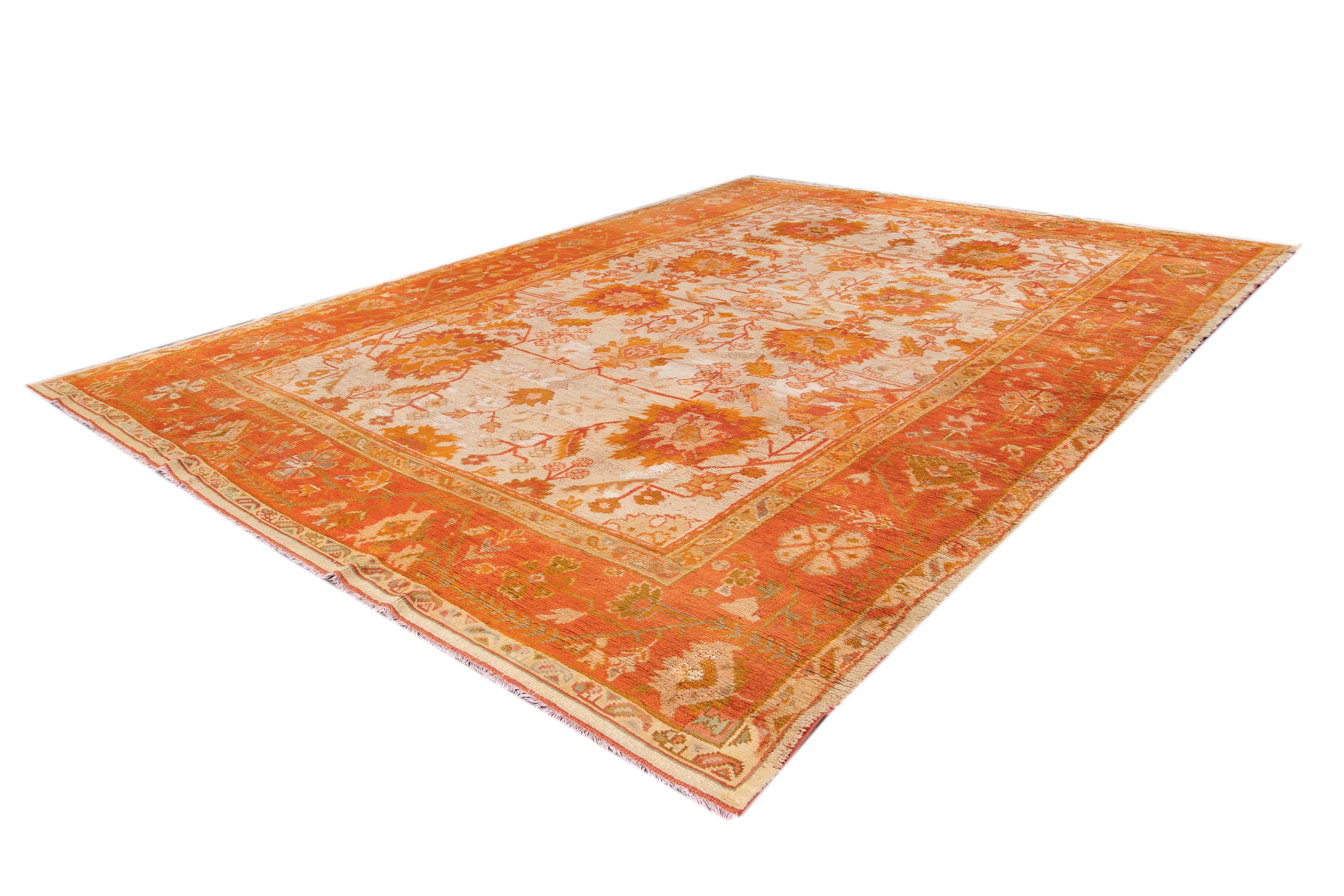 Hand-Knotted 19th Century Ivory and Orange Turkish Oushak Rug For Sale